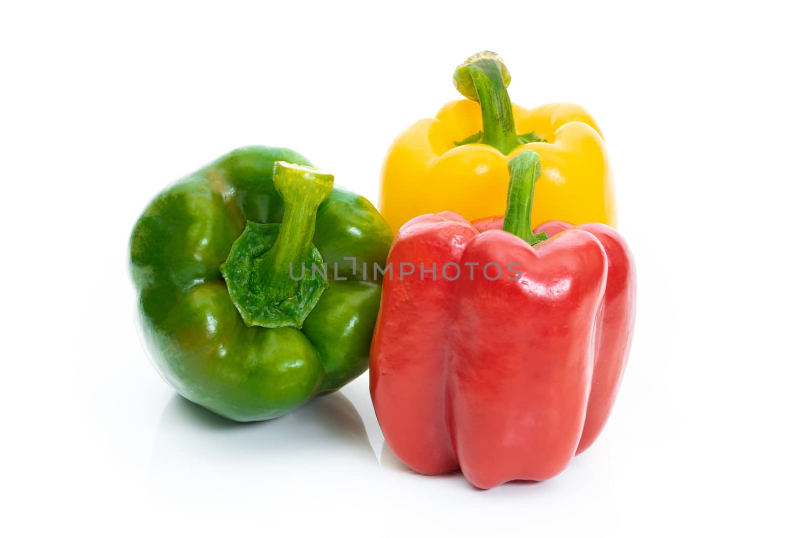 Large bell pepper red, green and yellow on a white background by sompongtom