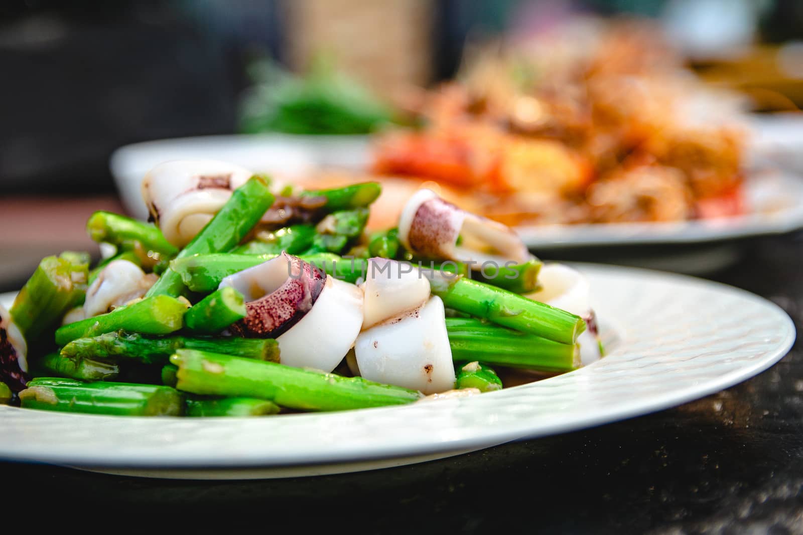 Squid puff with asparagus of restaurant with other dishes