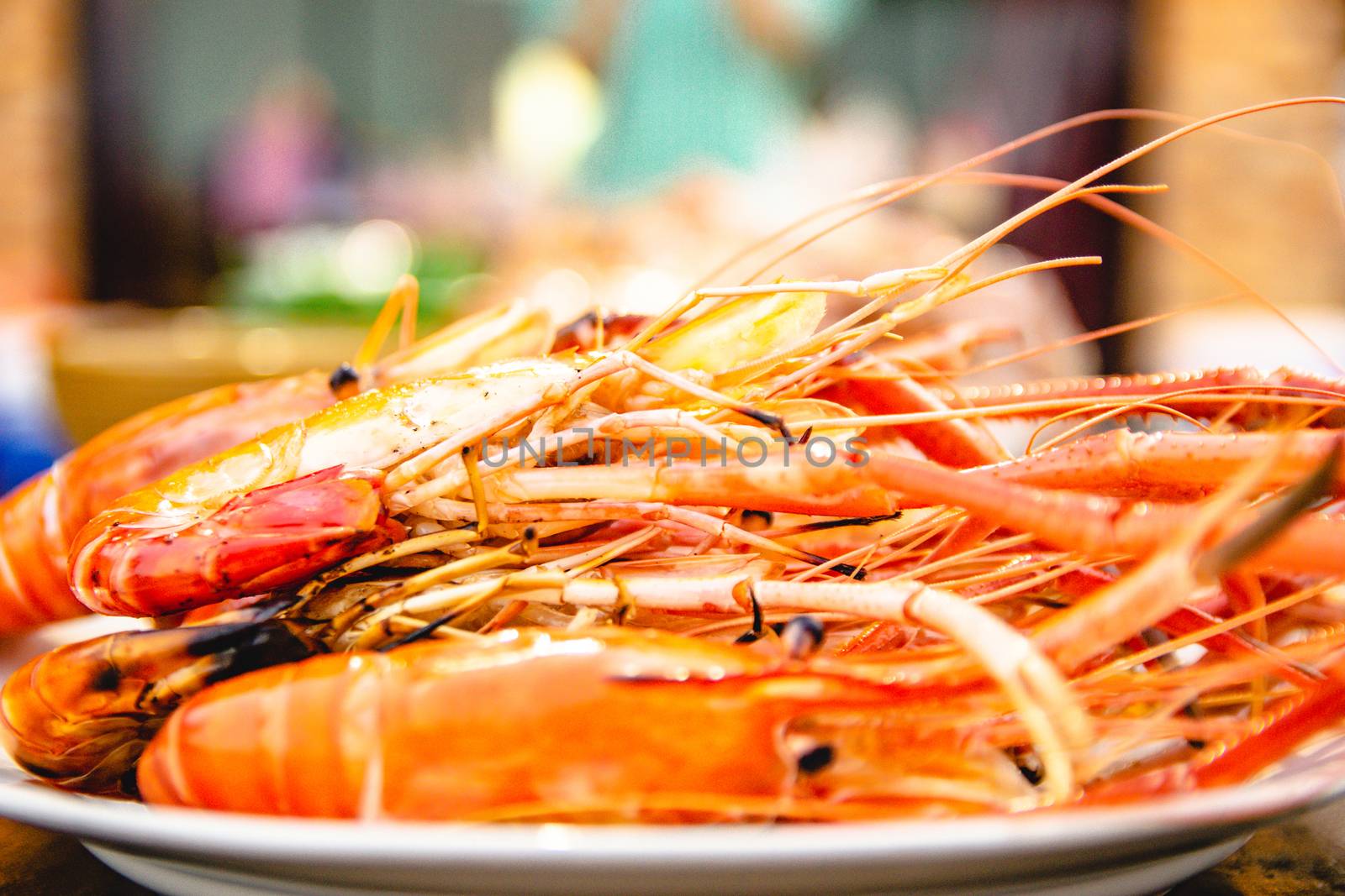 Shrimp grill seafood of restaurant with other dishes in the background