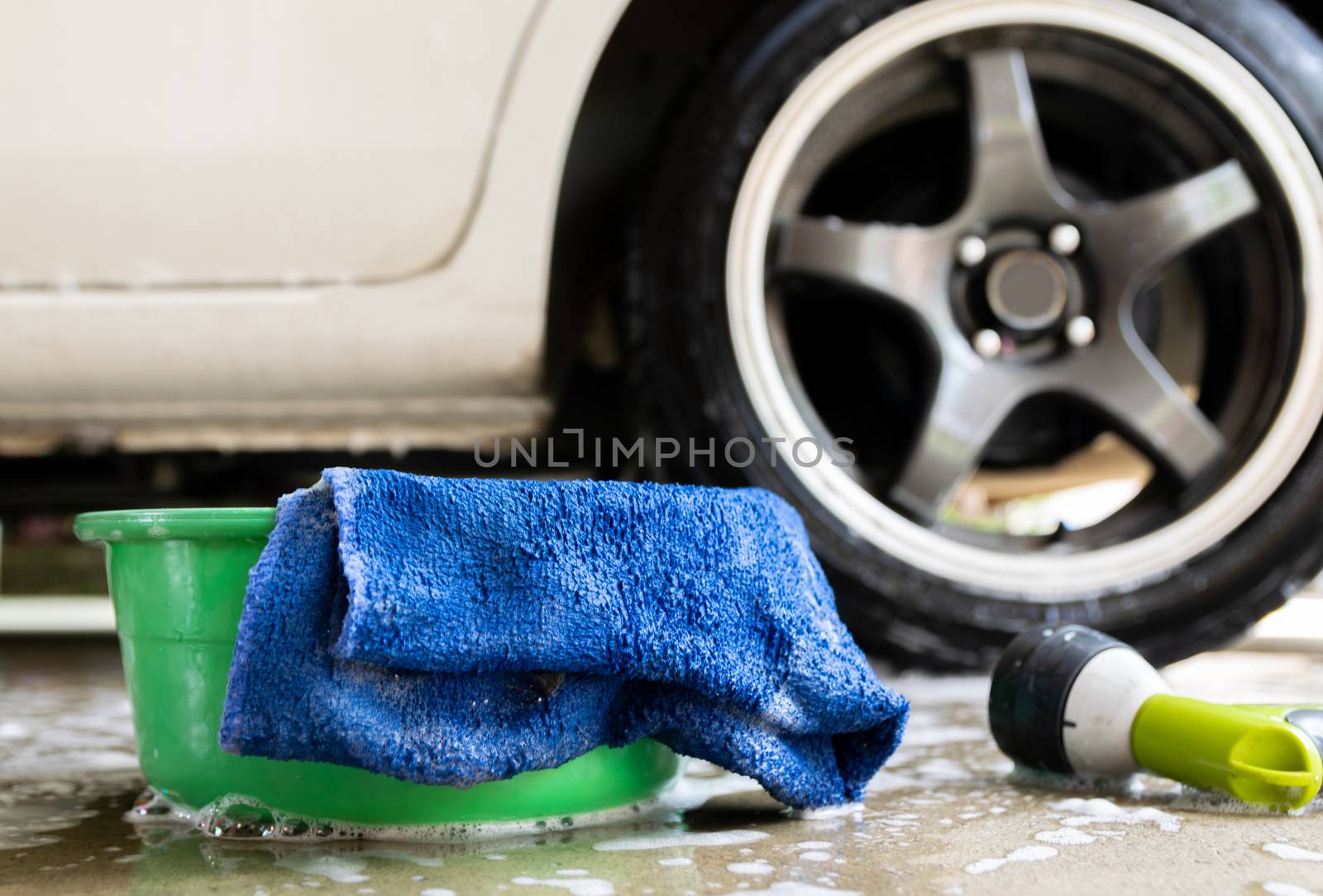 wash a car fabric and bubbles to clean the car