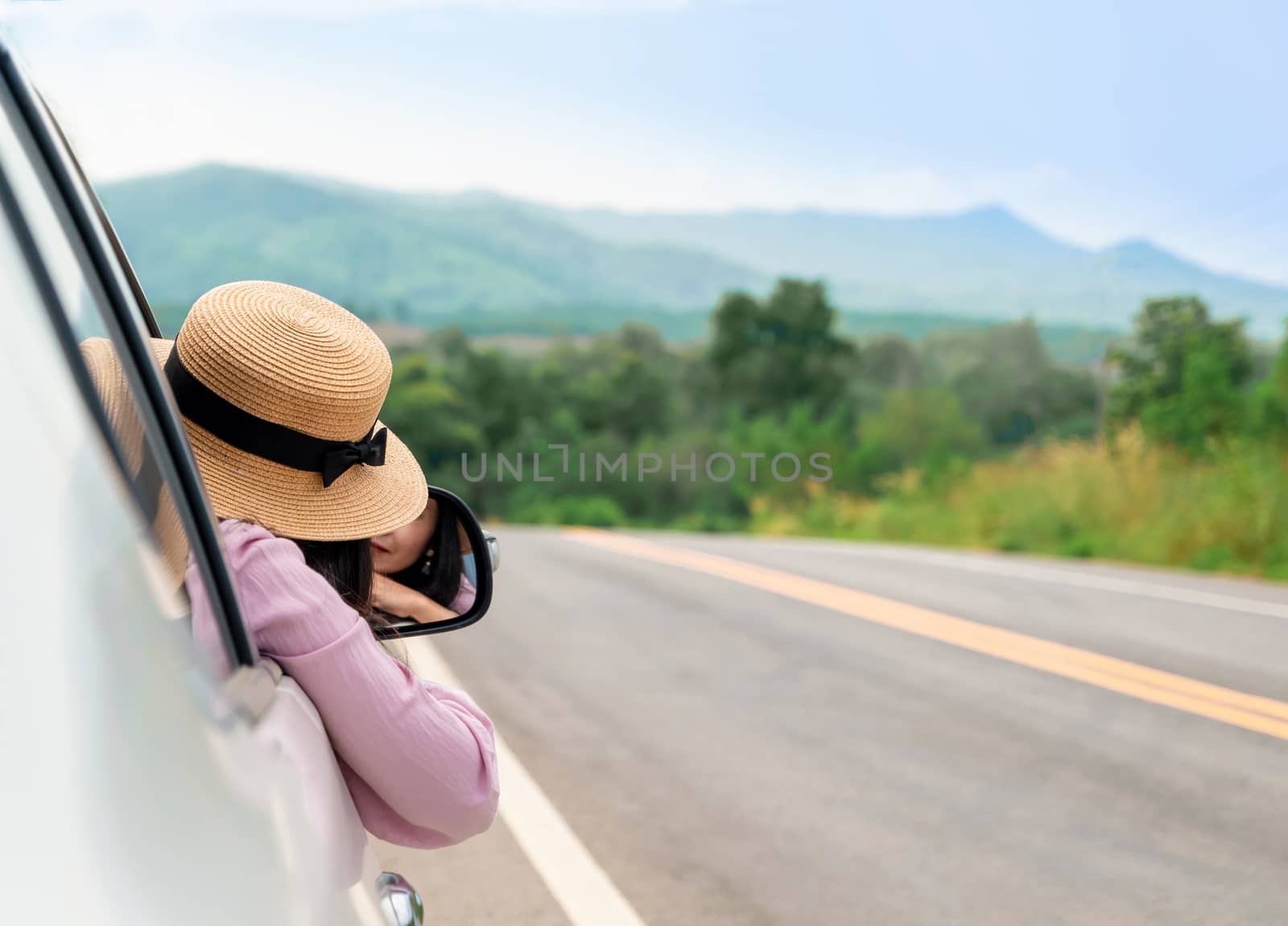 Woman driving on the road Travel by car relax