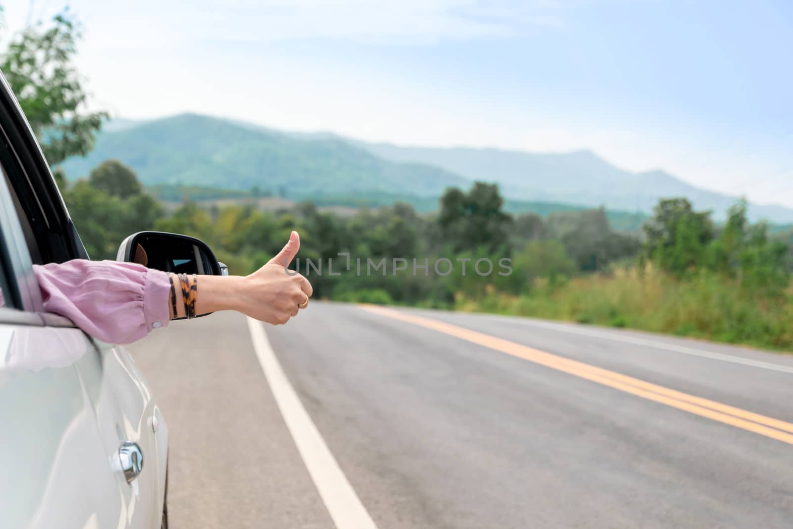 Woman driving on the road Travel by car relax