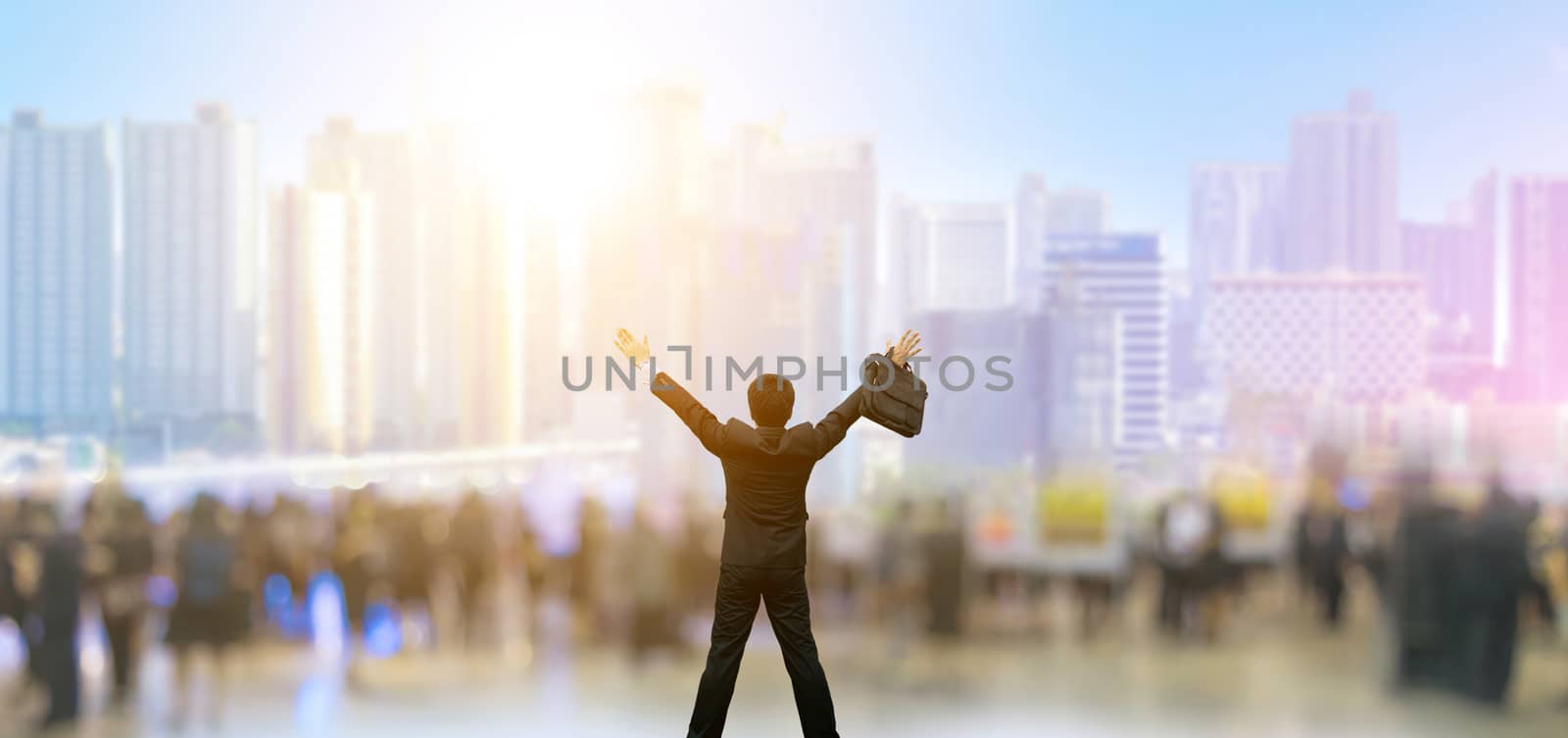 Businessman happy city background and people are blurred