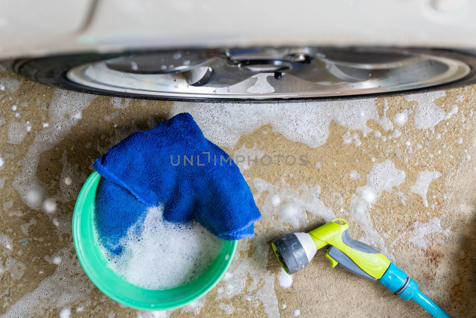 wash a car fabric and bubbles to clean the car