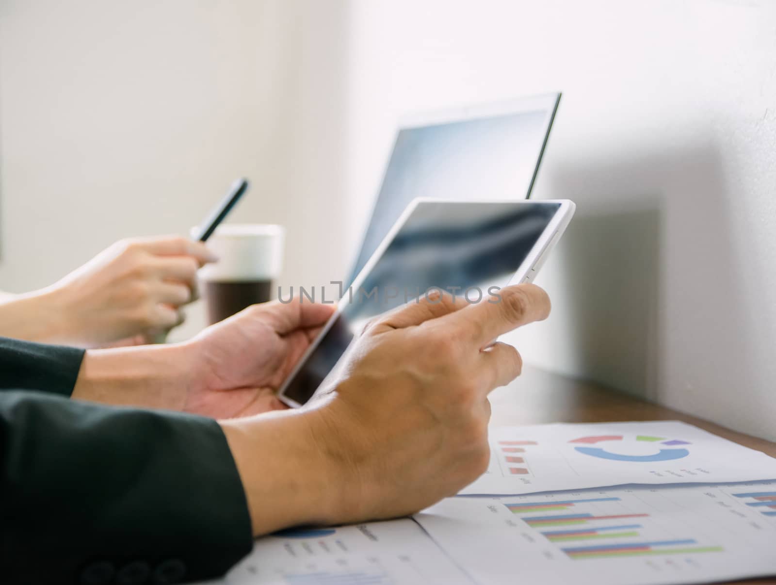 Business hand pointing to computer Human work in the office on the desk