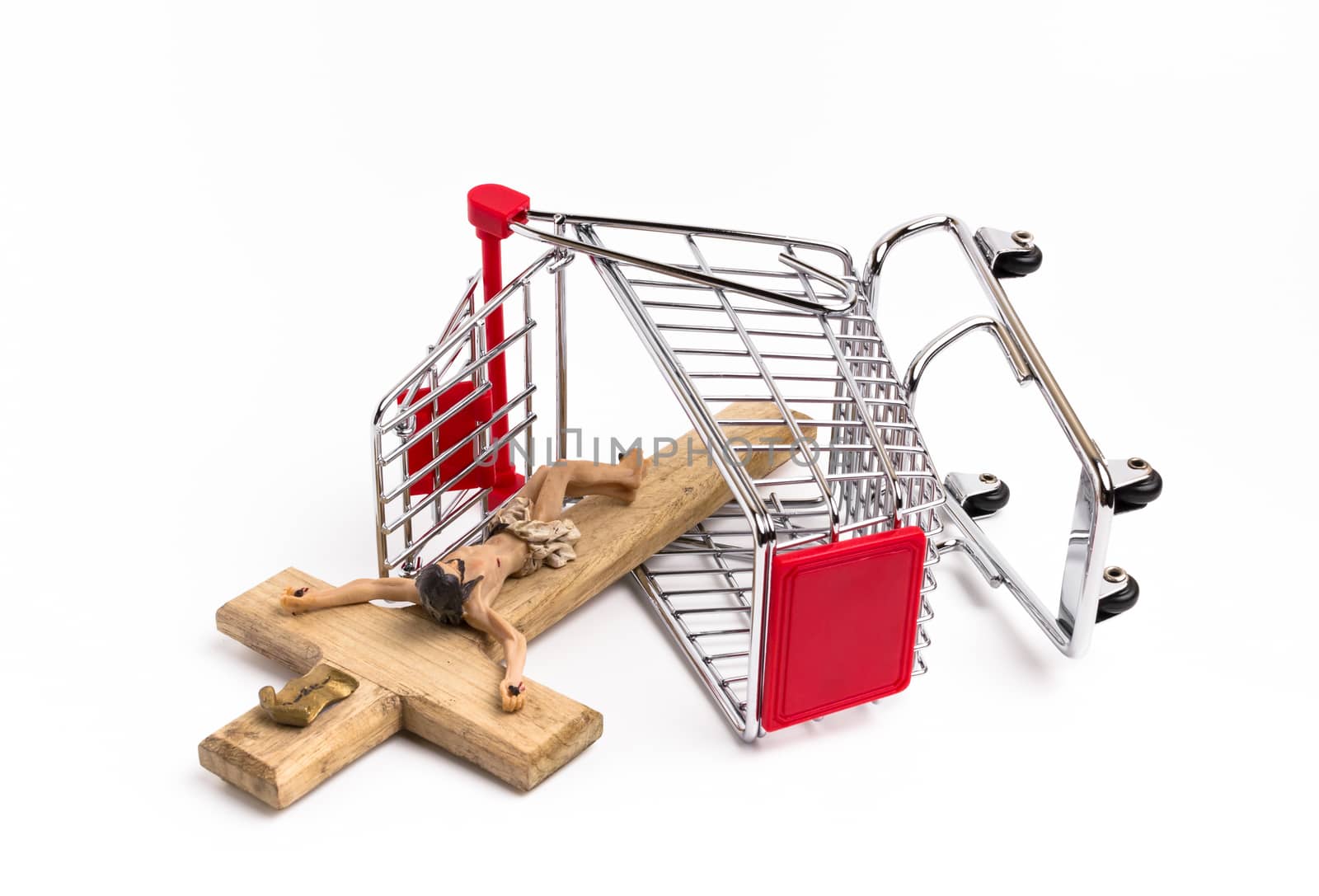 Shopping cart overturned with crucifix on the ground by germanopoli