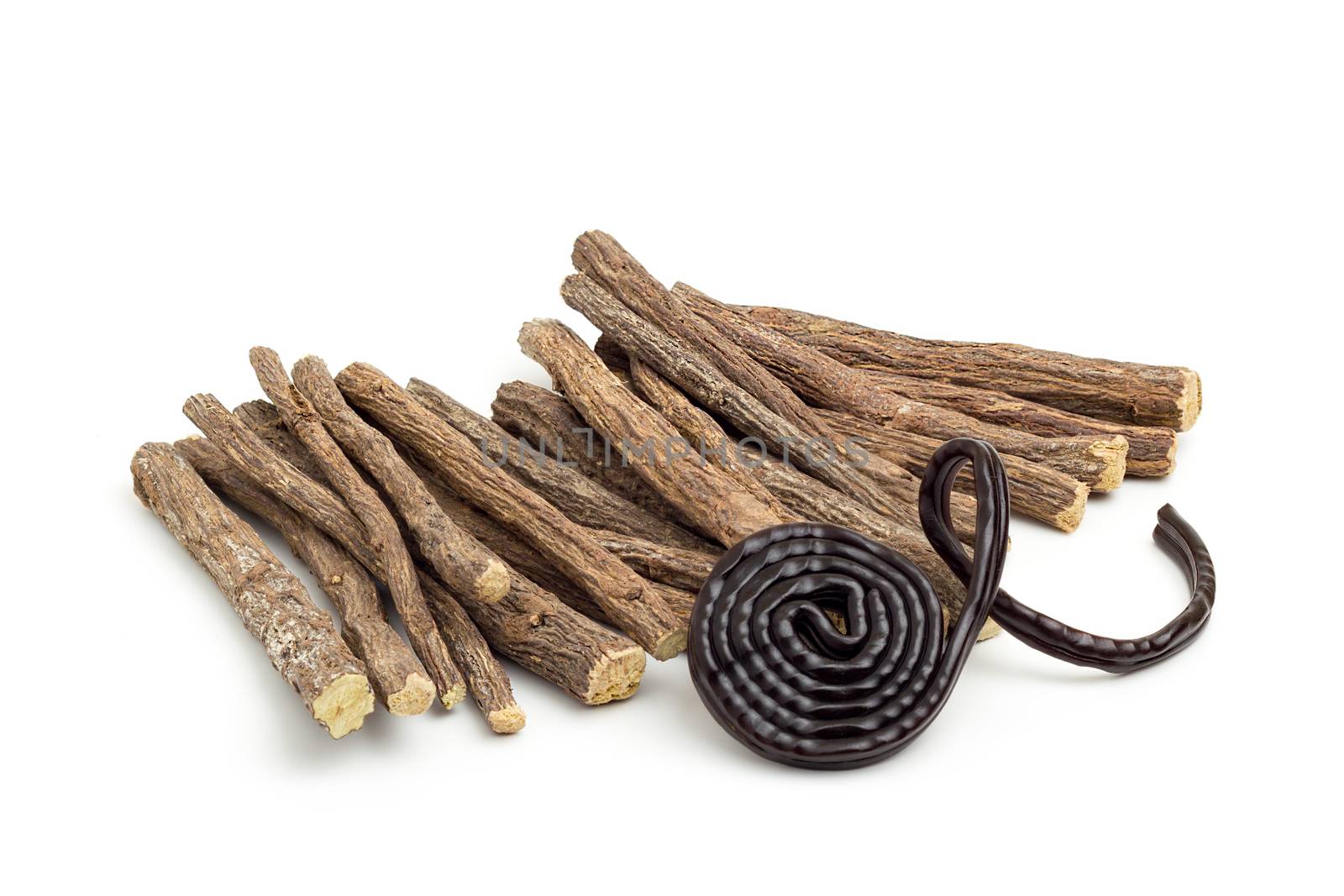 Liqorice roots and black wheel on white background