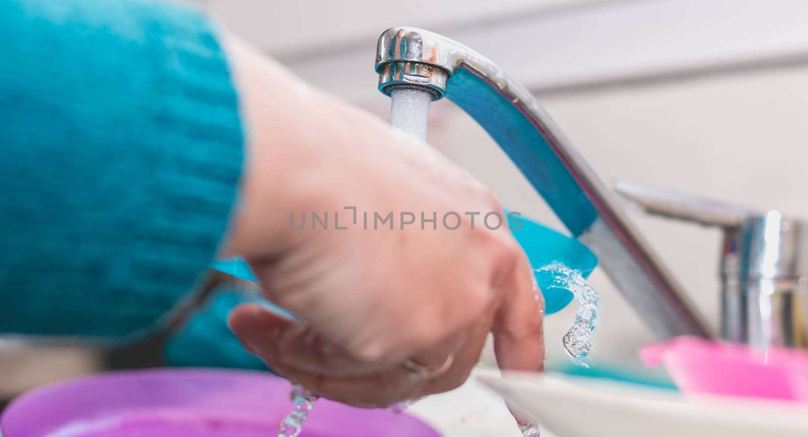 Close up of the hand doing dishes by AtlanticEUROSTOXX