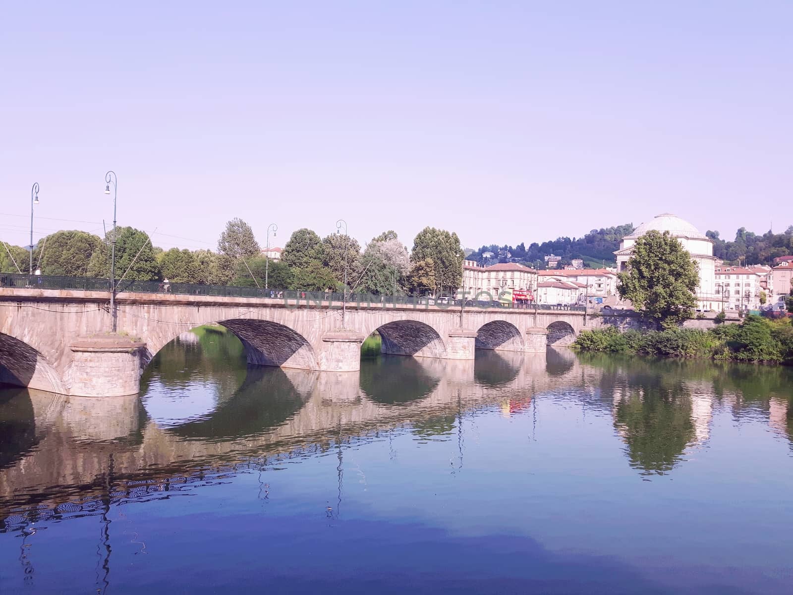 Turin, Italy - 06/06/2020: Beautiful panoramic view from Mole Antoneliana to the city of Turin in summer days with clear blue sky and the alps in the background.