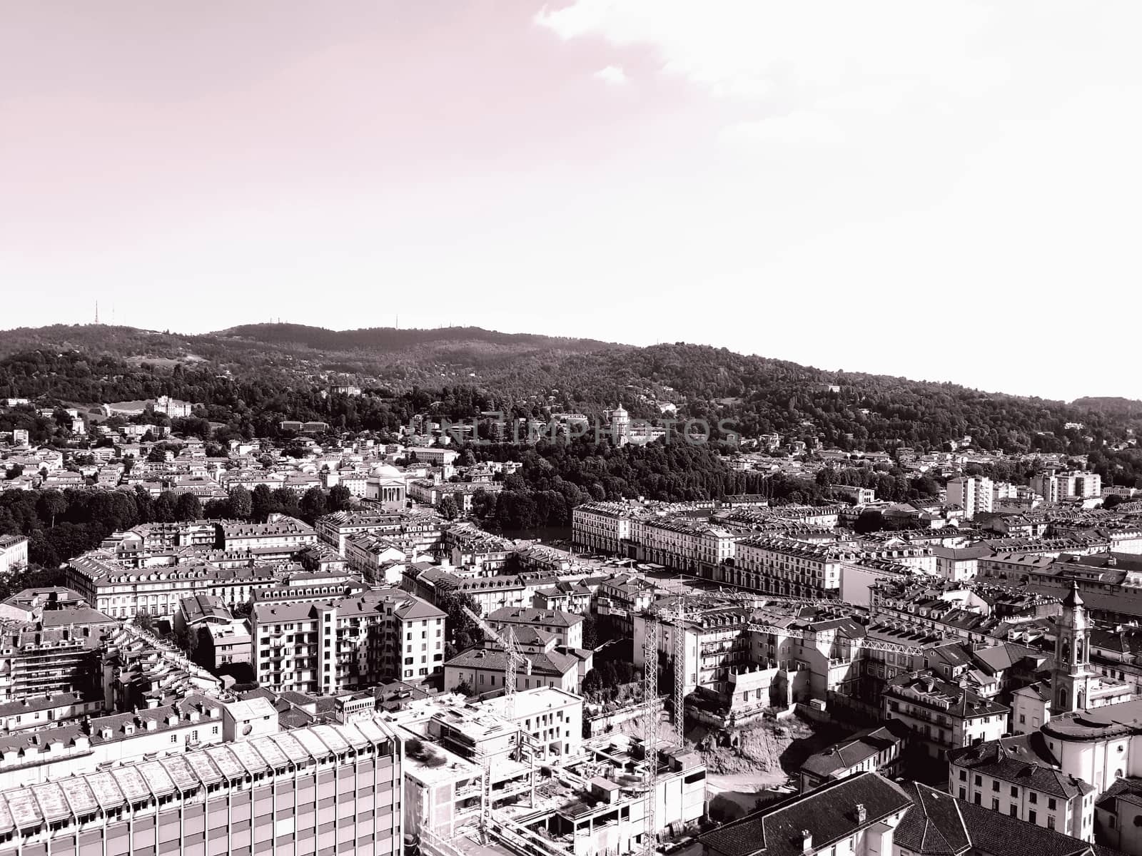 Turin, Italy - 06/06/2020: Beautiful panoramic view from Mole Antoneliana to the city of Turin in summer days with clear blue sky and the alps in the background.