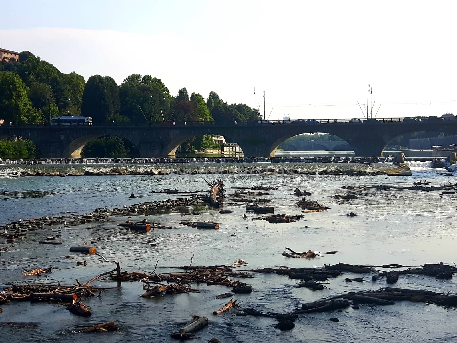 Turin, Italy - 06/06/2020: Beautiful panoramic view from Mole Antoneliana to the city of Turin in summer days with clear blue sky and the alps in the background.