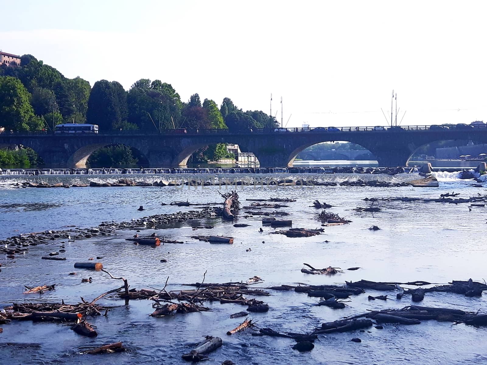 Turin, Italy - 06/06/2020: Beautiful panoramic view from Mole Antoneliana to the city of Turin in summer days with clear blue sky and the alps in the background.