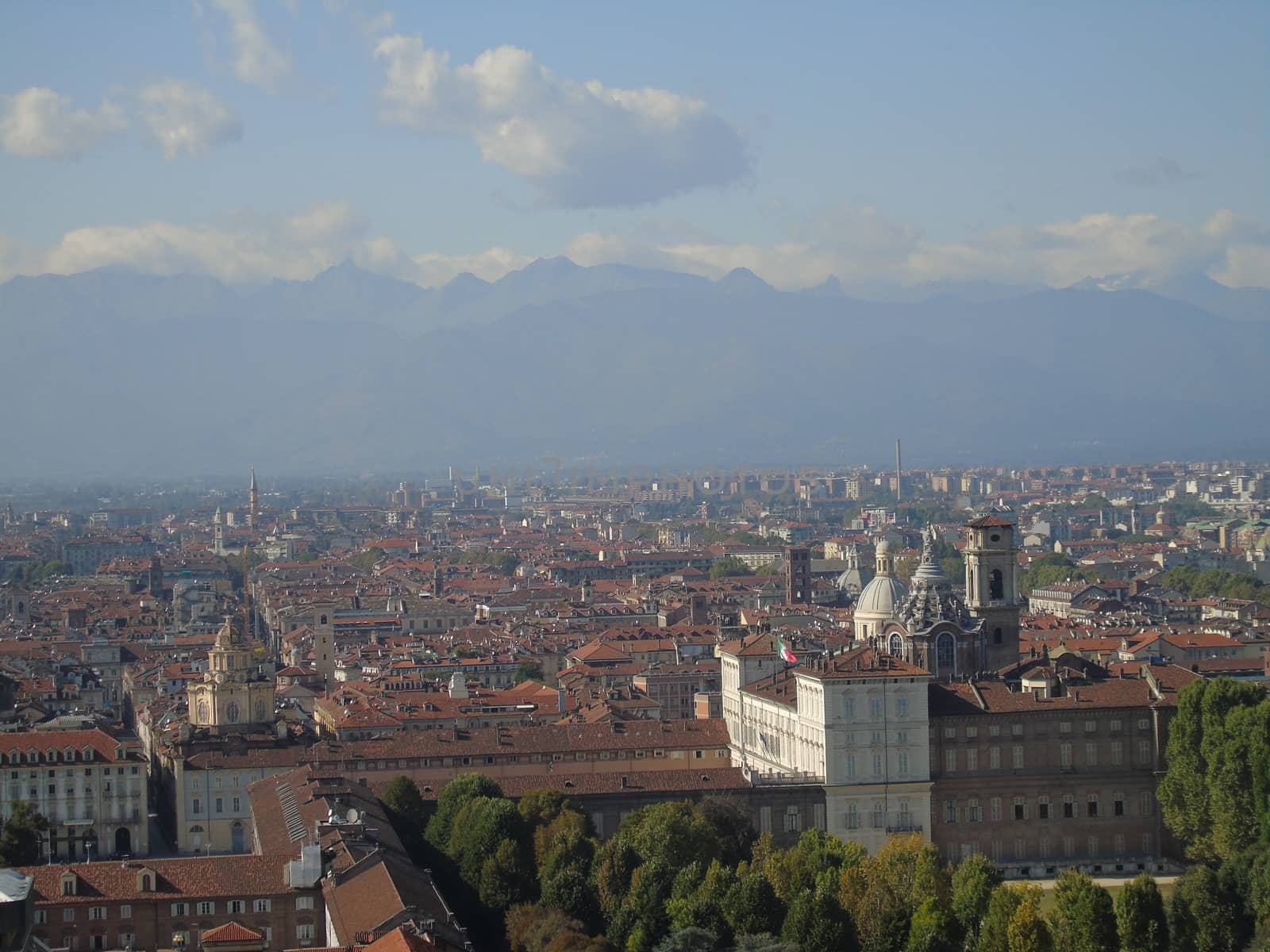 Turin, Italy - 06/06/2020: Beautiful panoramic view from Mole Antoneliana to the city of Turin in summer days with clear blue sky and the alps in the background.