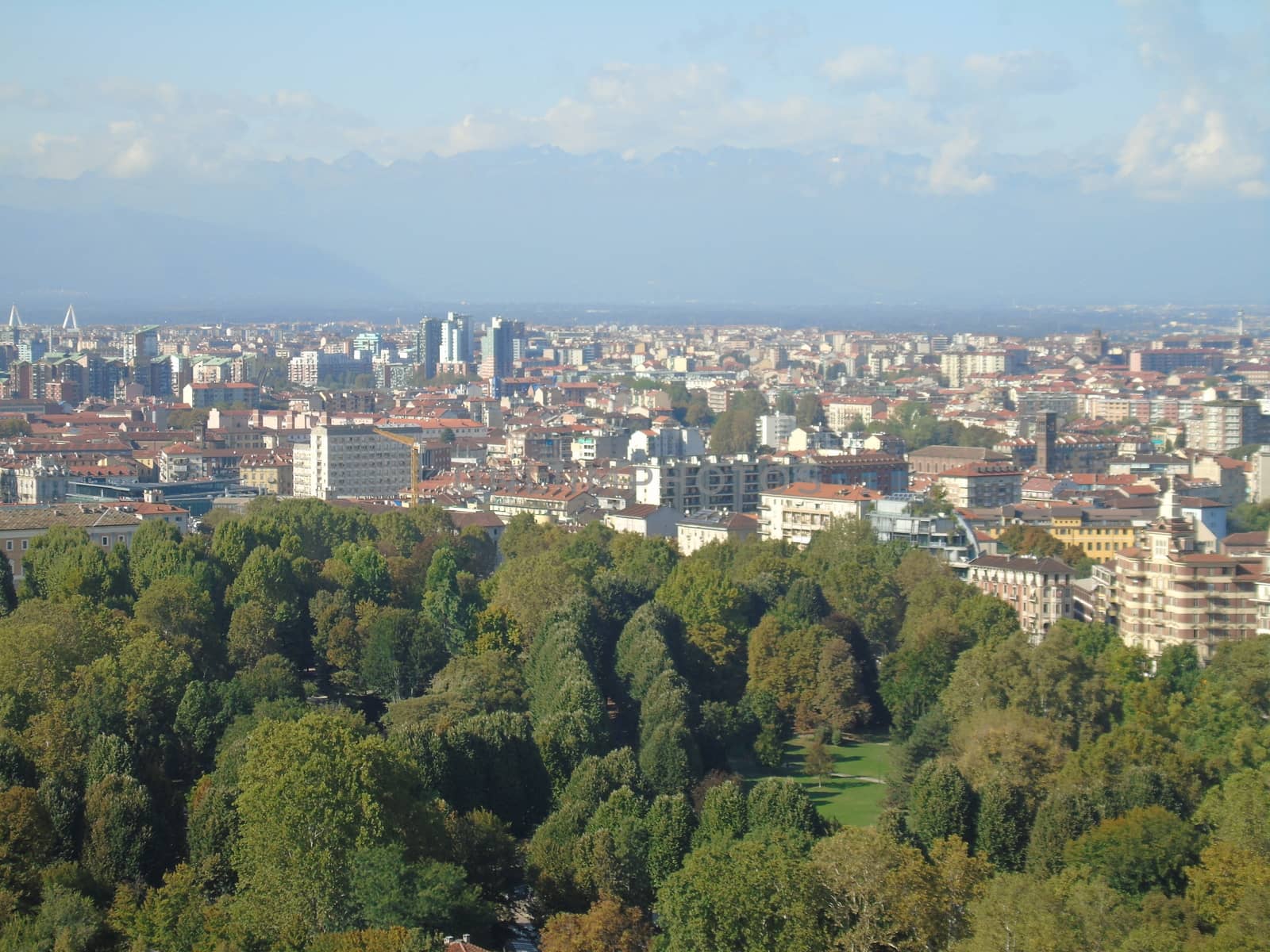 Turin, Italy - 06/06/2020: Beautiful panoramic view from Mole Antoneliana to the city of Turin in summer days with clear blue sky and the alps in the background.