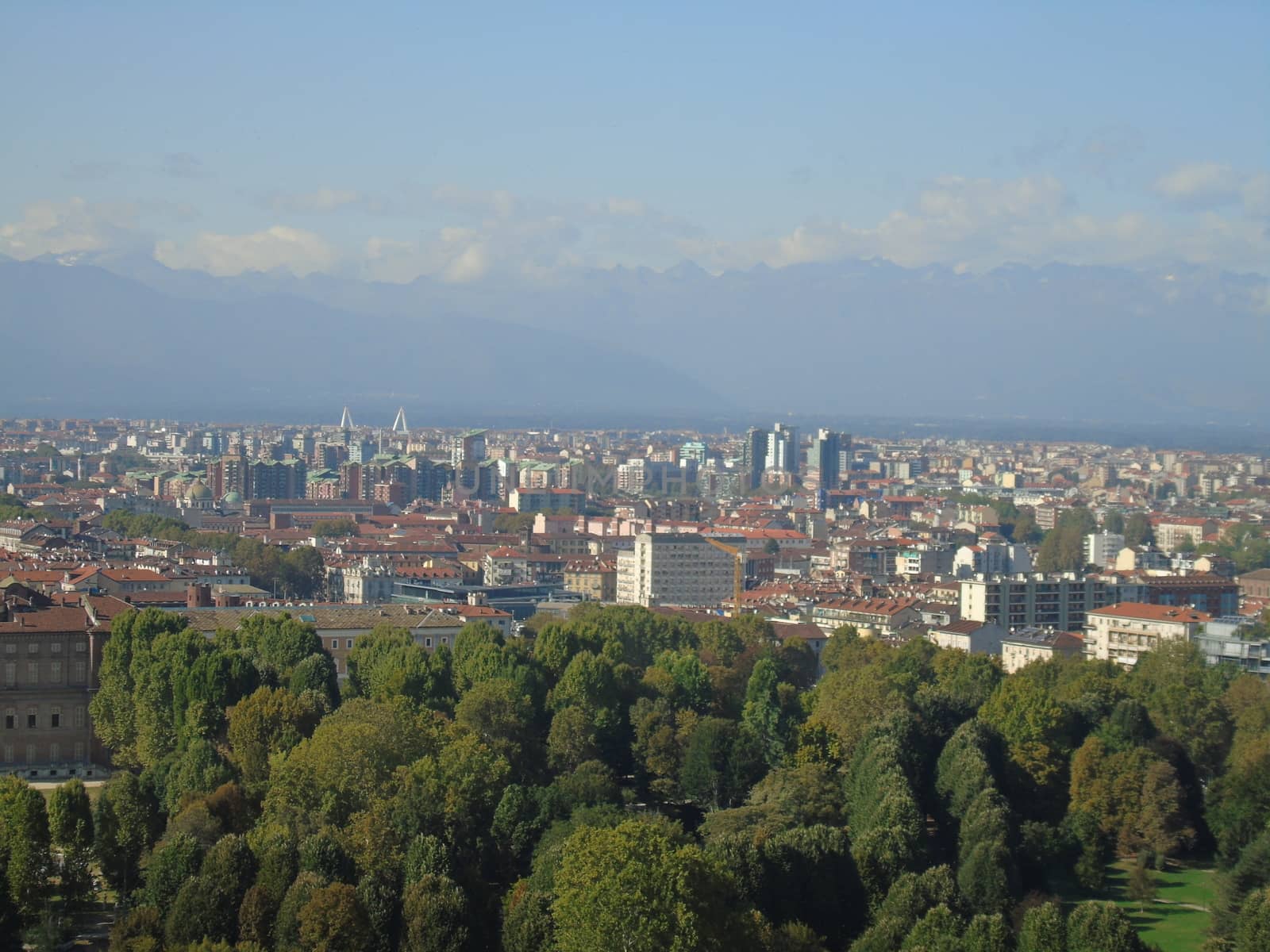 Turin, Italy - 06/06/2020: Beautiful panoramic view from Mole Antoneliana to the city of Turin in summer days with clear blue sky and the alps in the background.