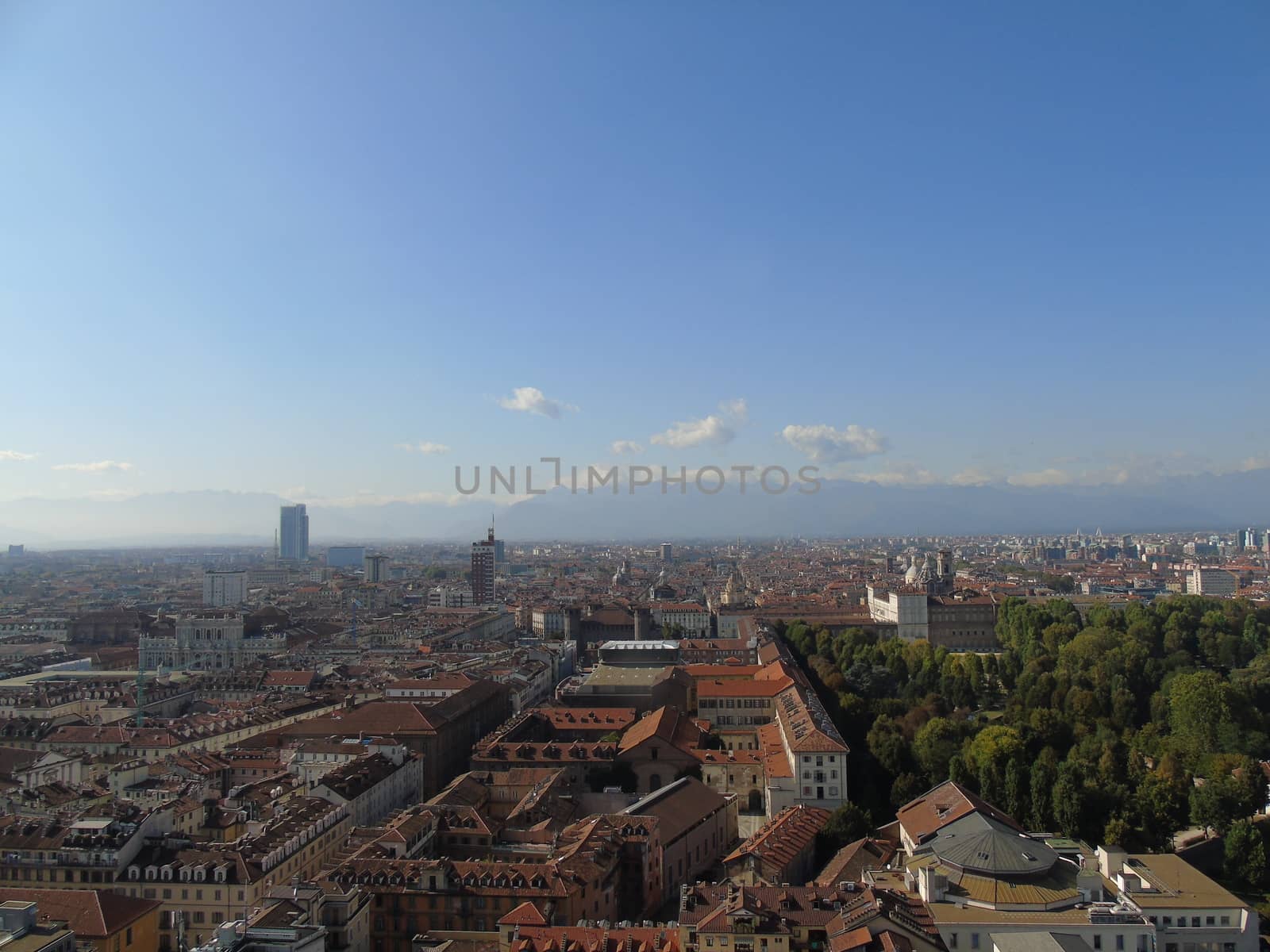 Turin, Italy - 06/06/2020: Beautiful panoramic view from Mole Antoneliana to the city of Turin in summer days with clear blue sky and the alps in the background.