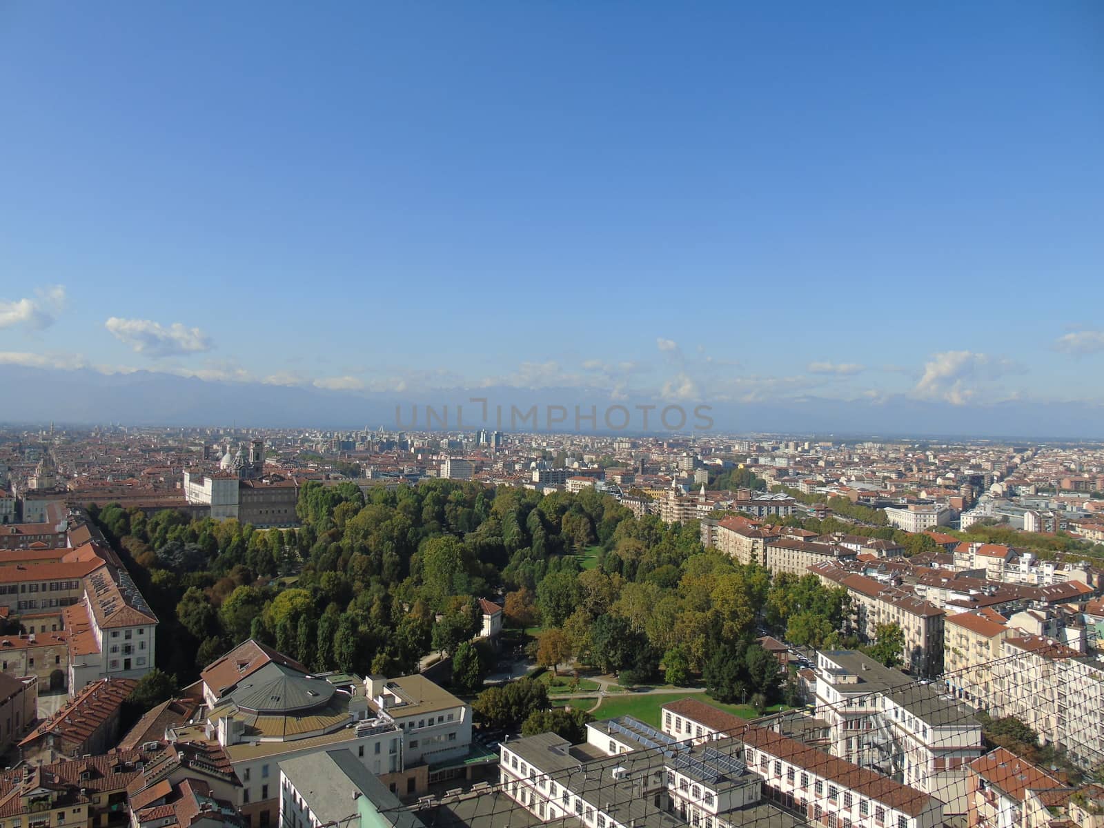 Turin, Italy - 06/06/2020: Beautiful panoramic view from Mole Antoneliana to the city of Turin in summer days with clear blue sky and the alps in the background.