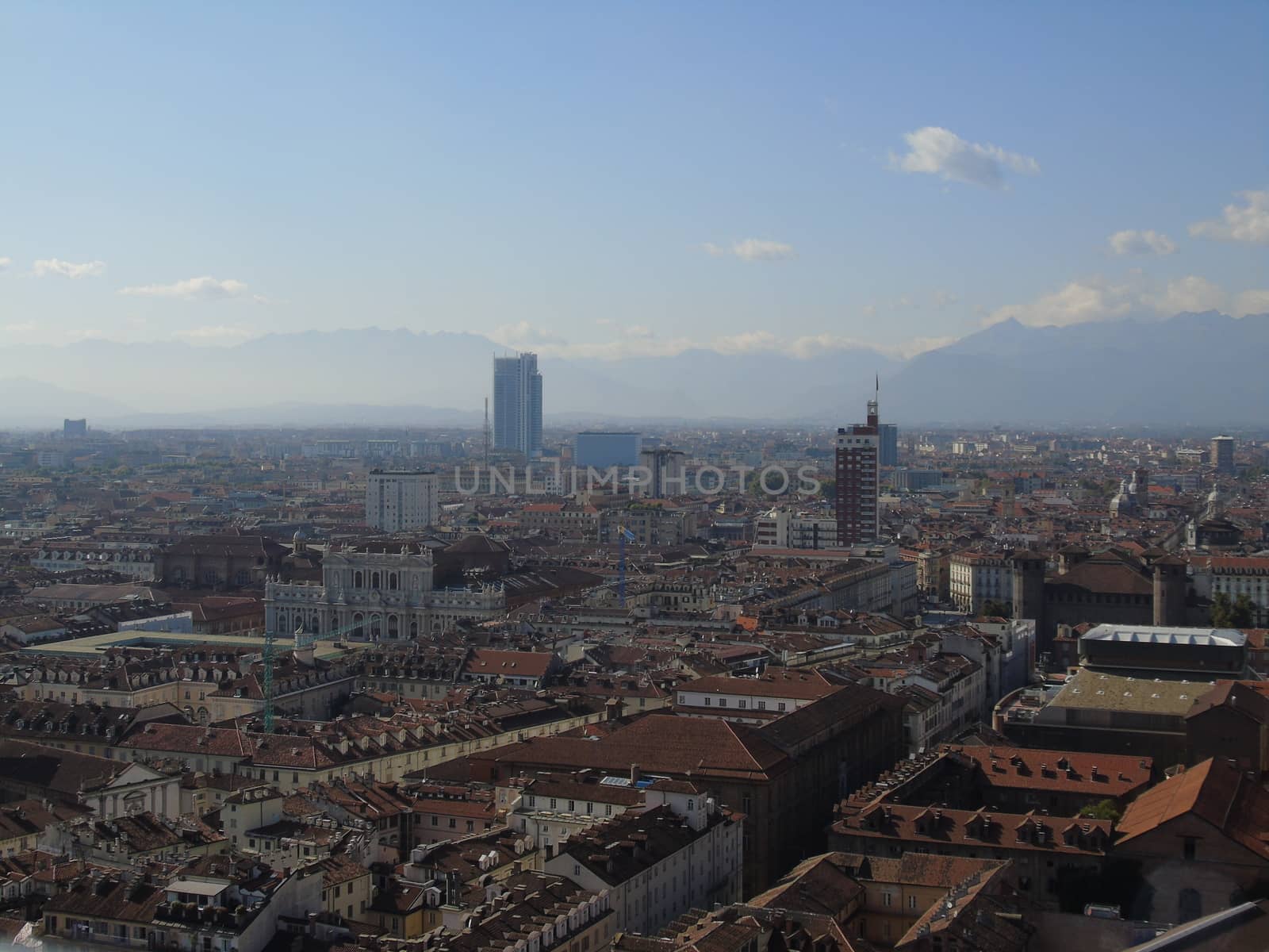 Turin, Italy - 06/06/2020: Beautiful panoramic view from Mole Antoneliana to the city of Turin in summer days with clear blue sky and the alps in the background.