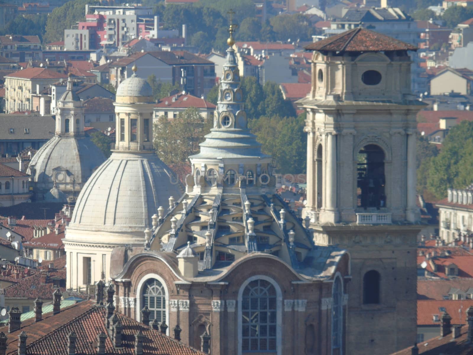 Turin, Italy - 06/06/2020: Beautiful panoramic view from Mole Antoneliana to the city of Turin in summer days with clear blue sky and the alps in the background.