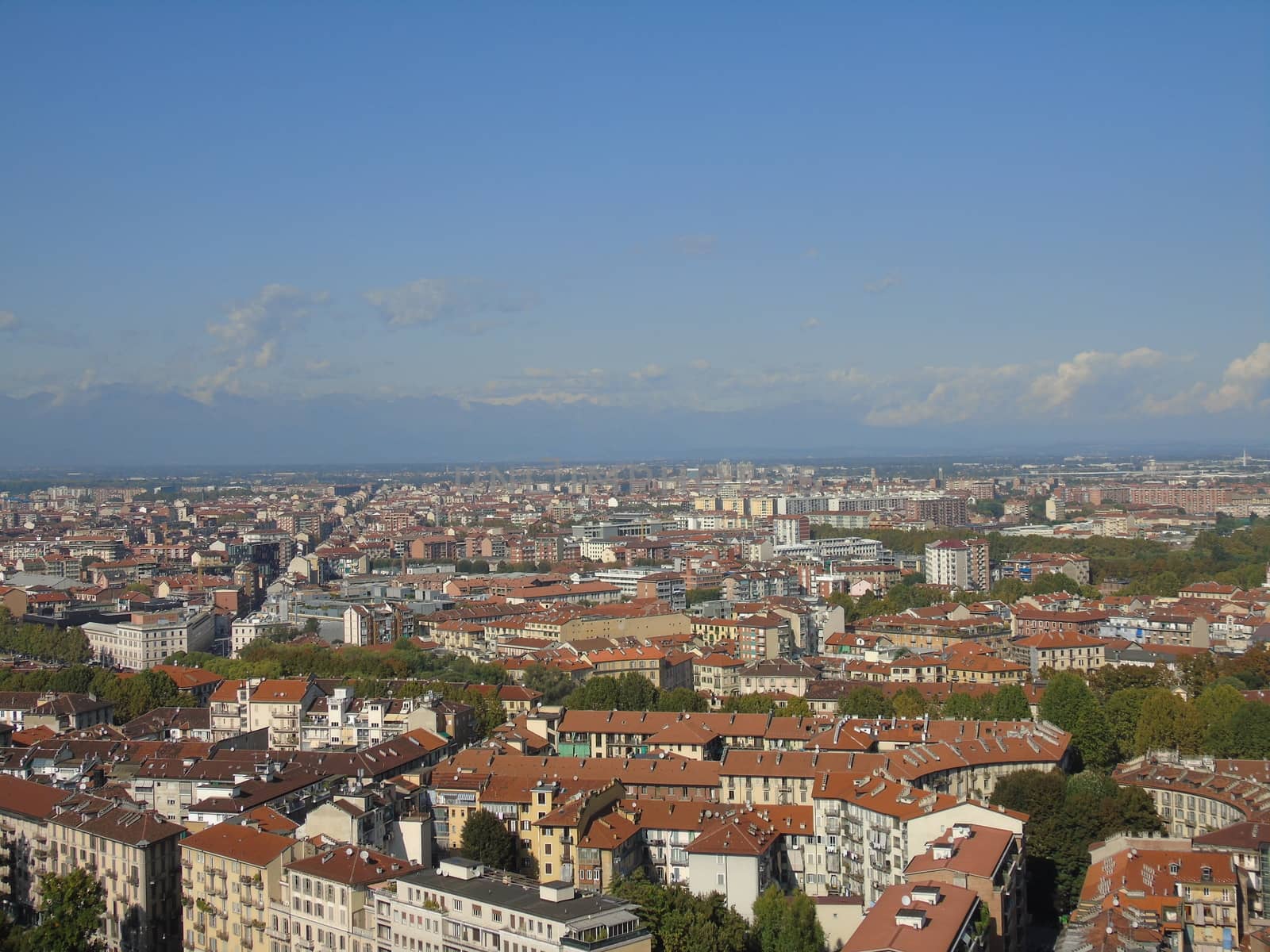 Turin, Italy - 06/06/2020: Beautiful panoramic view from Mole Antoneliana to the city of Turin in summer days with clear blue sky and the alps in the background.