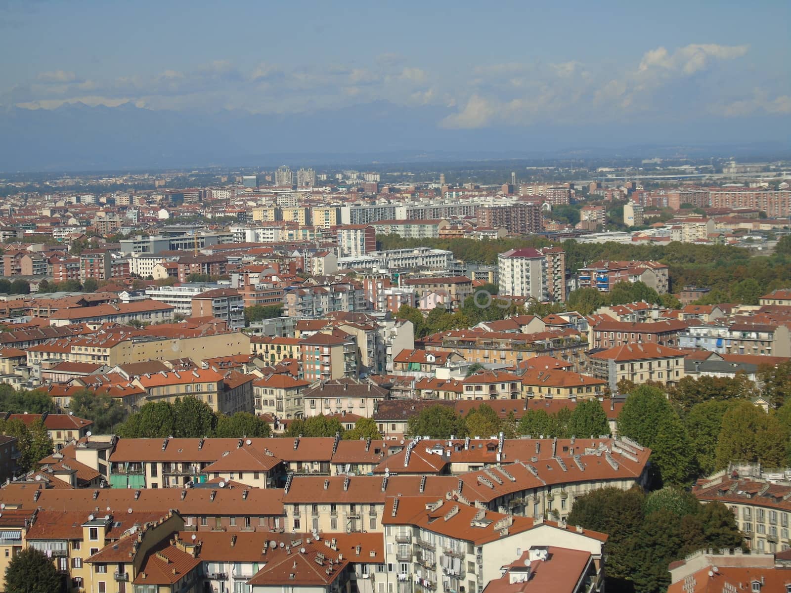 Turin, Italy - 06/06/2020: Beautiful panoramic view from Mole Antoneliana to the city of Turin in summer days with clear blue sky and the alps in the background.