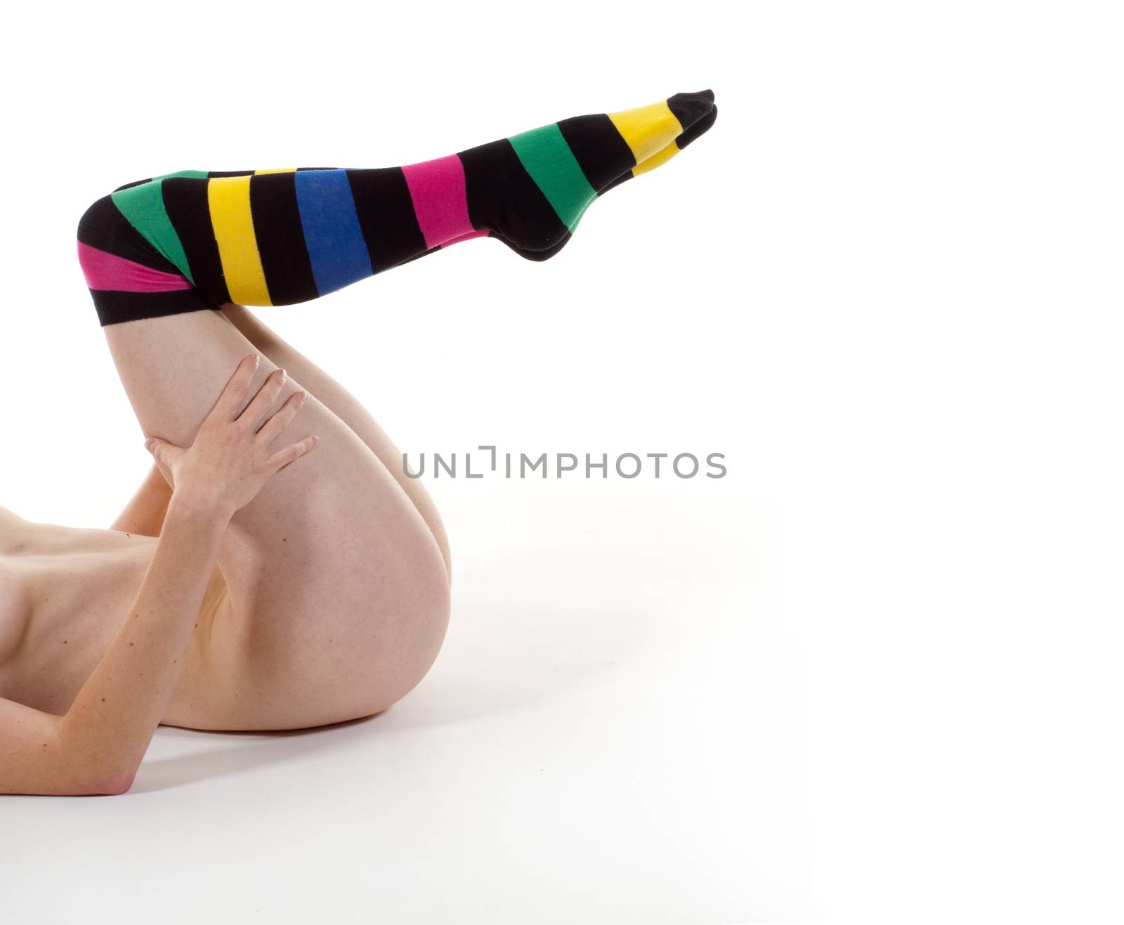 Nude Woman in Stripy Socks Lying on the Floor