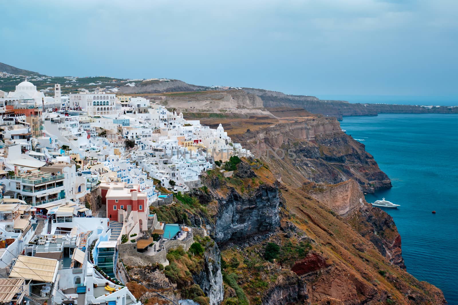 View of Fira Greek town with traditional white houses on Santorini island by dimol