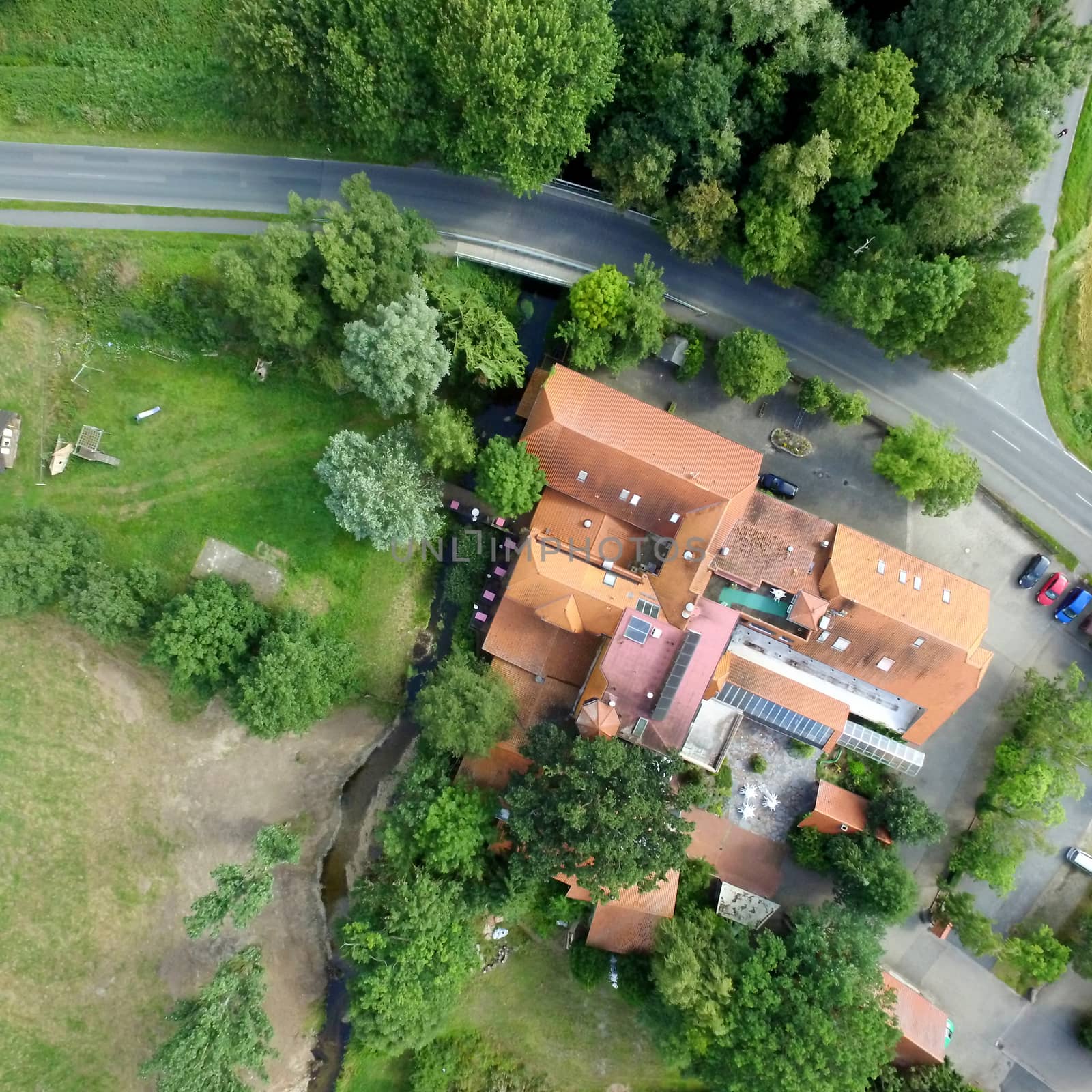 Aerial photo of a former water mill, vertical photograph.made with drone
