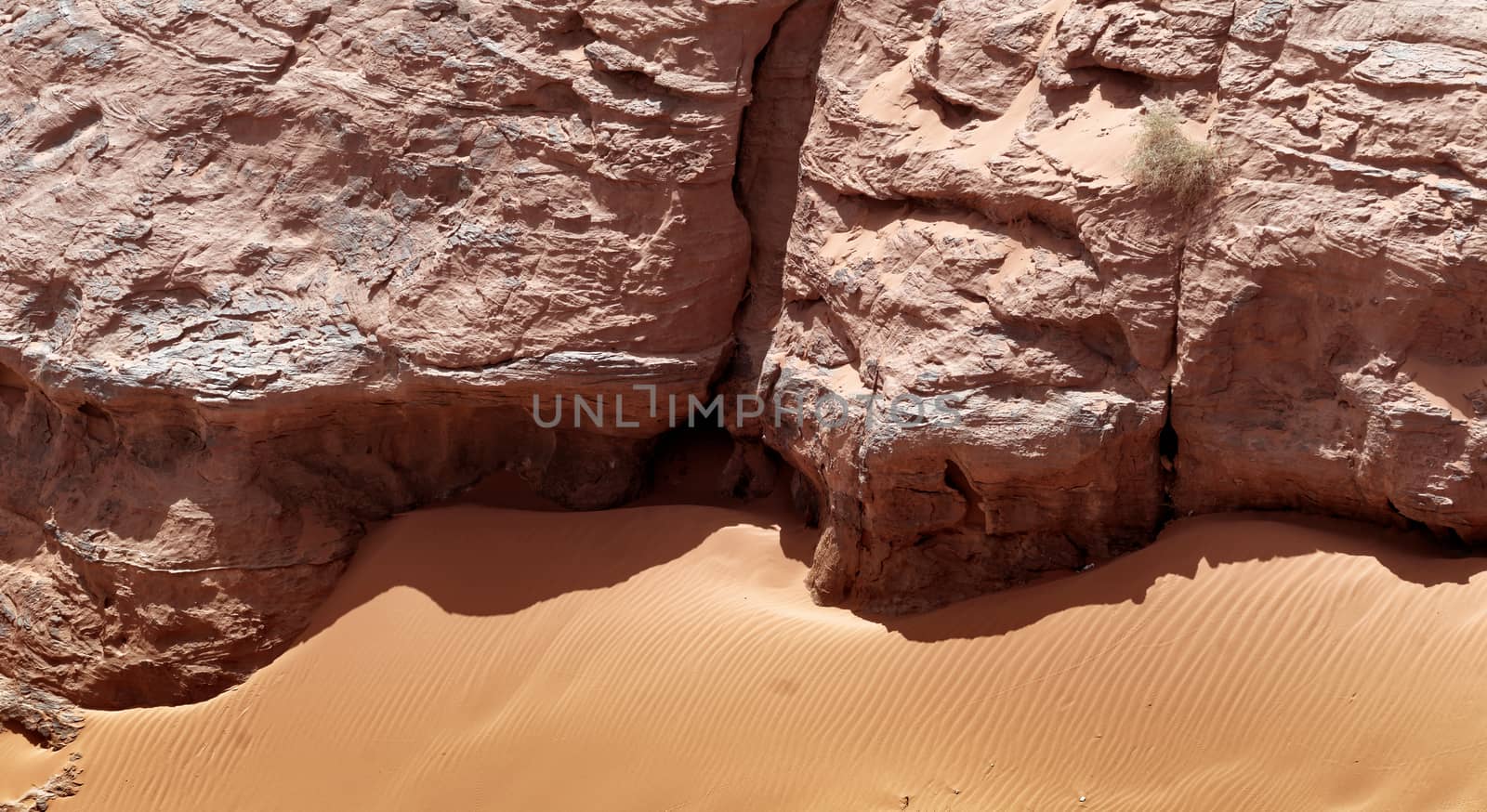 Rock and fine sand with ripple marks and wind ripples in the desert of Wadi Rum, Jordan, middle east
