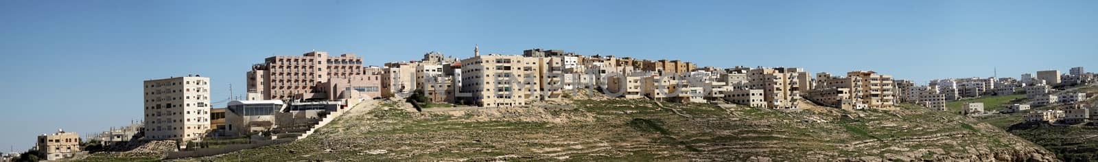Composite high-resolution panorama of the high-rise housing estate on the outskirts of the city of Karak in Jordan. by geogif
