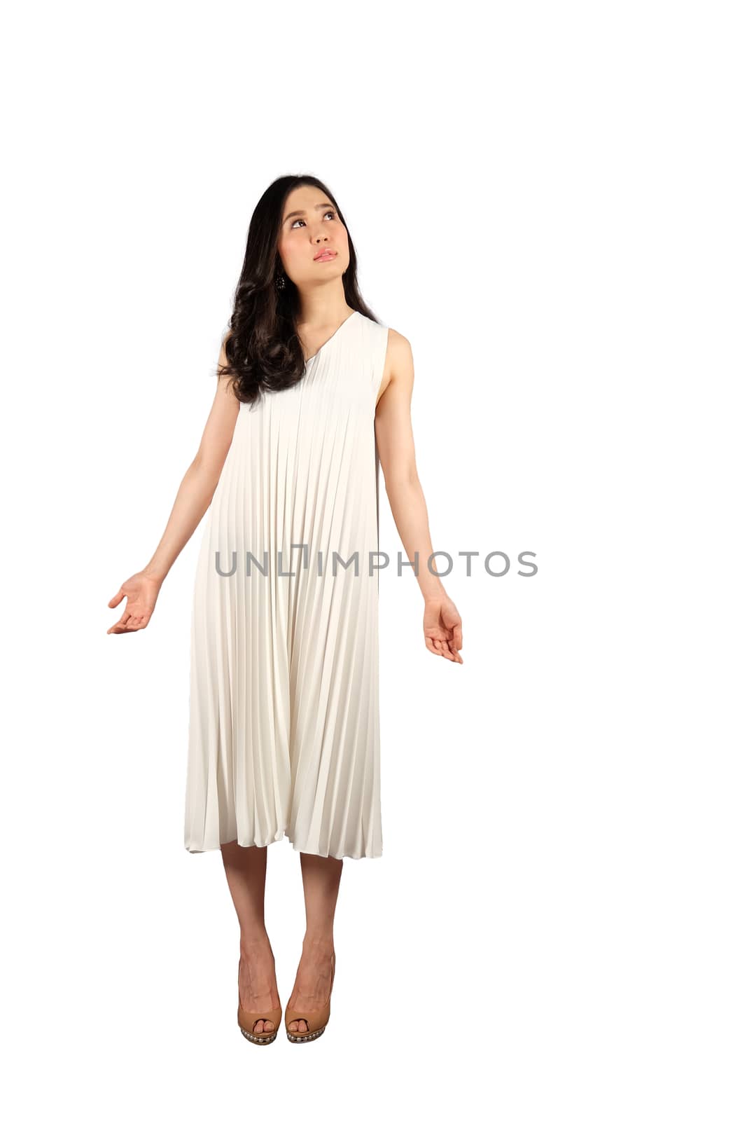 Young asian woman in white dress looking at the space for text on white isolate with clipping path