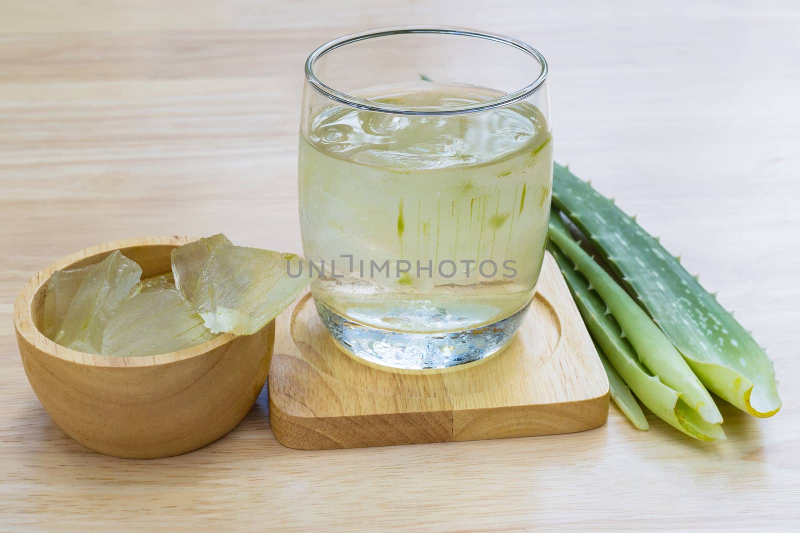 Aloe Vera for drinking on wood table 
