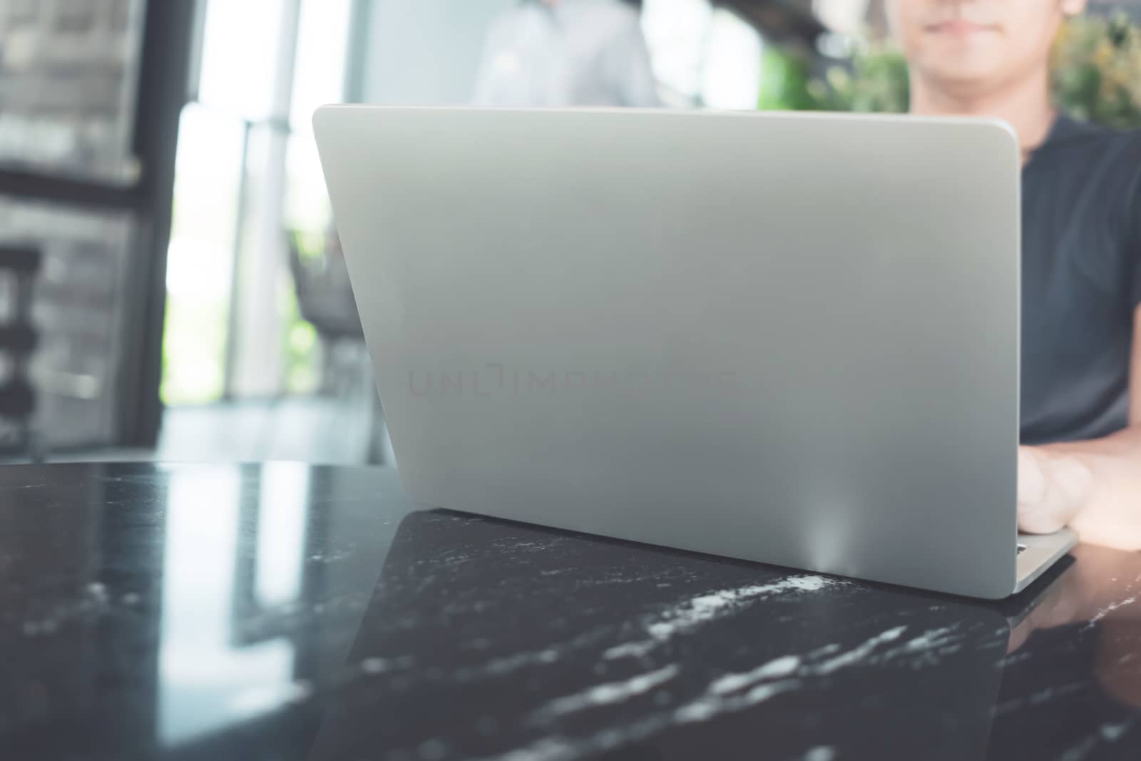 People using laptop to work study on work desk with clean nature background background. Business, financial, trade stock maket and social network. by Suwant