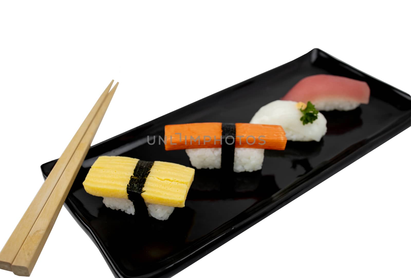 Different kinds of sushi with chopstick on plate