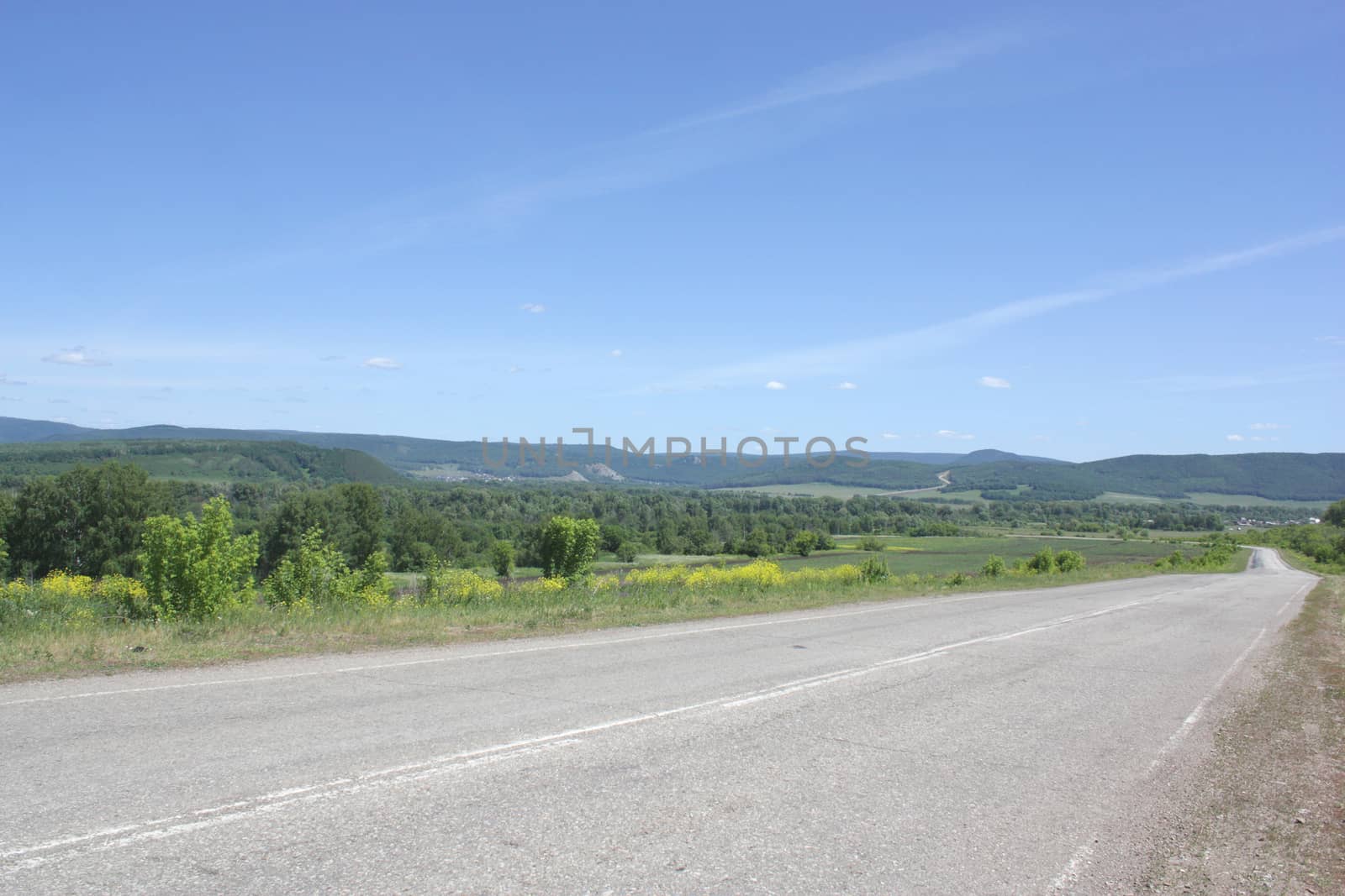 Beautiful summer landscape with road to mountains