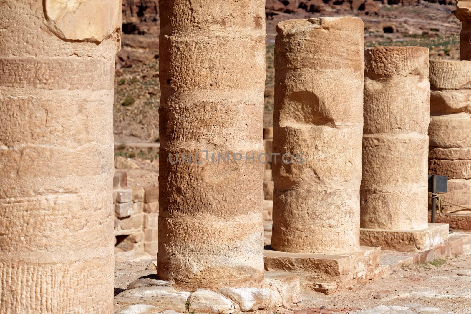 Close-up of Roman columns in the archaeological excavation site of Petra, Jordan by geogif