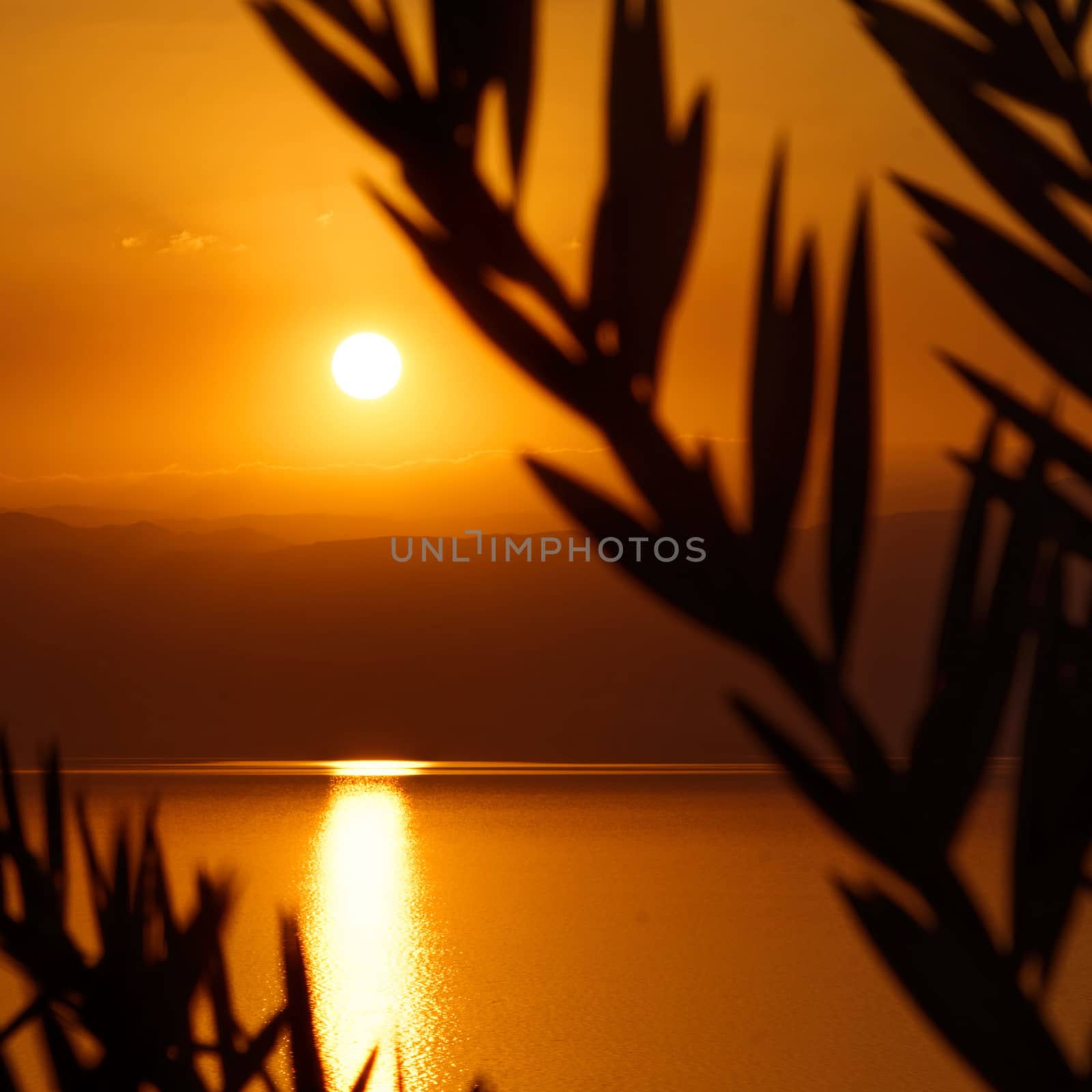 Sunset over the Dead Sea, view from the Jordanian shore to the Israeli mountains, middle east