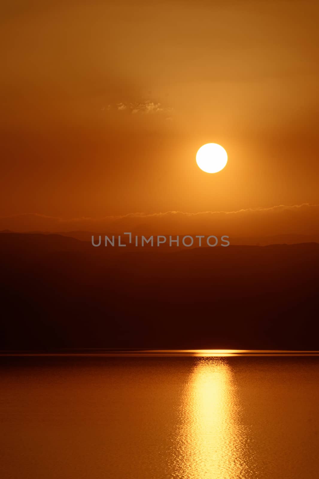 Sunset over the Dead Sea, view from the Jordanian shore to the Israeli mountains, middle east