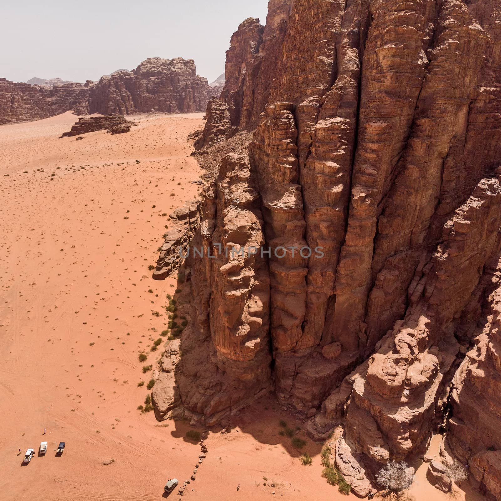 Aerial view, taken with the drone, of rock formations and monolithic mountains in the desert of Wadi Rum, Jordan by geogif