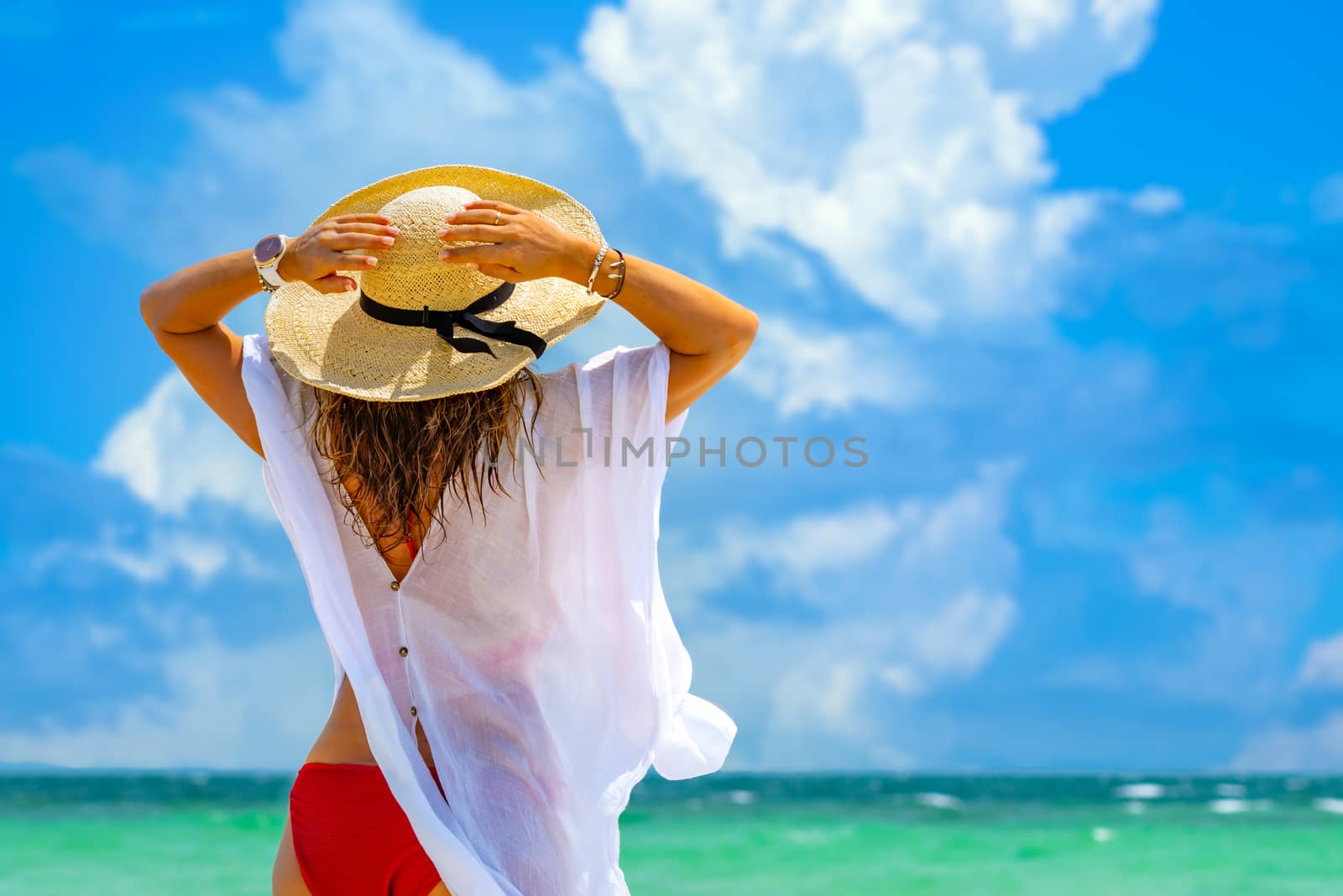 Woman at the beach in Thailand by Netfalls