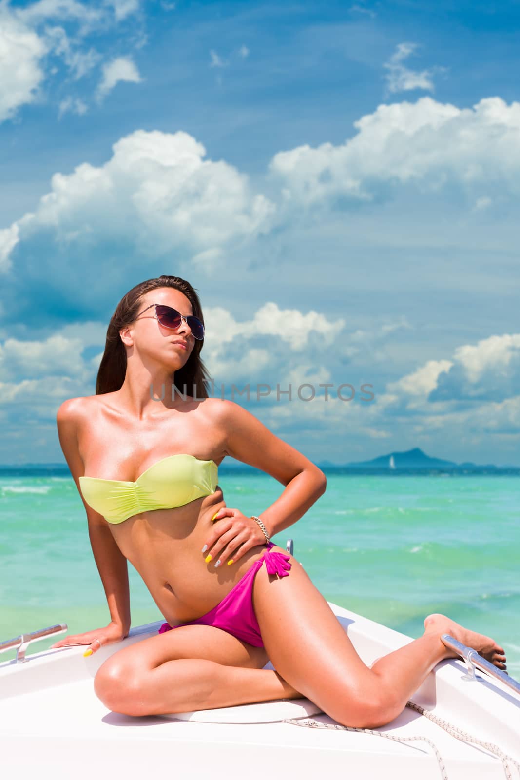 Beautiful Woman on a speedboat at the beach in Thailand