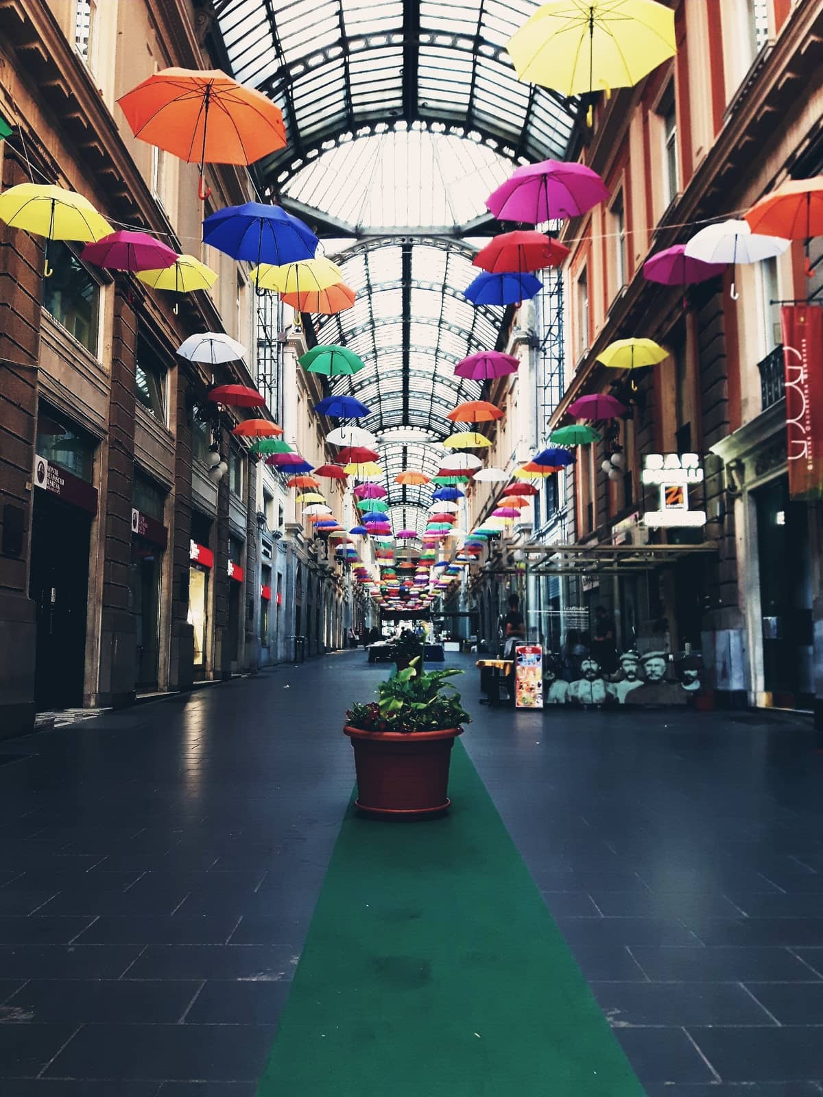 Genova, Italy - 06/01/2020: Bright abstract background of jumble of rainbow colored umbrellas over the city celebrating gay pride