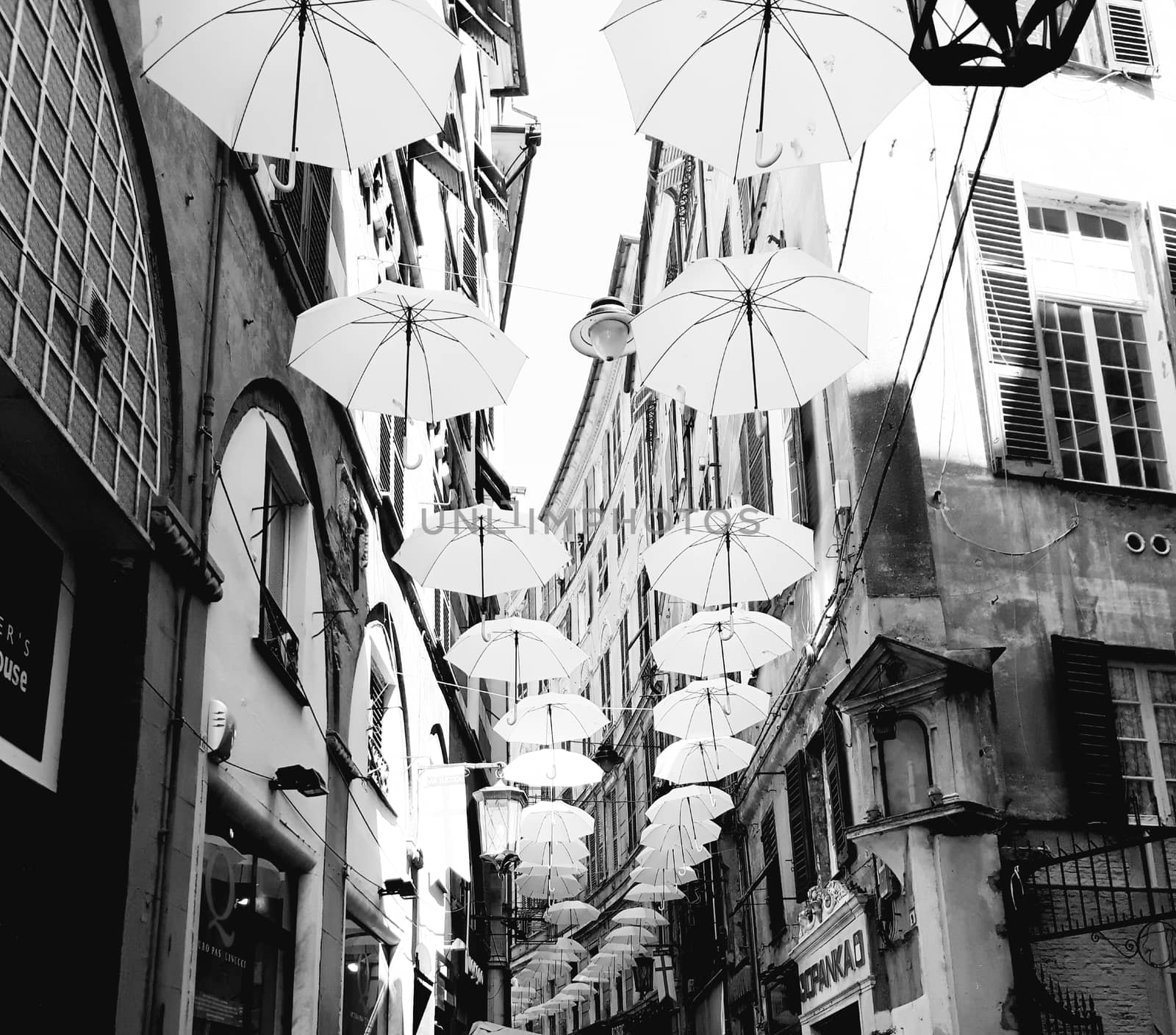 Genova, Italy - 06/01/2020: Bright abstract background of jumble of rainbow colored umbrellas over the city celebrating gay pride