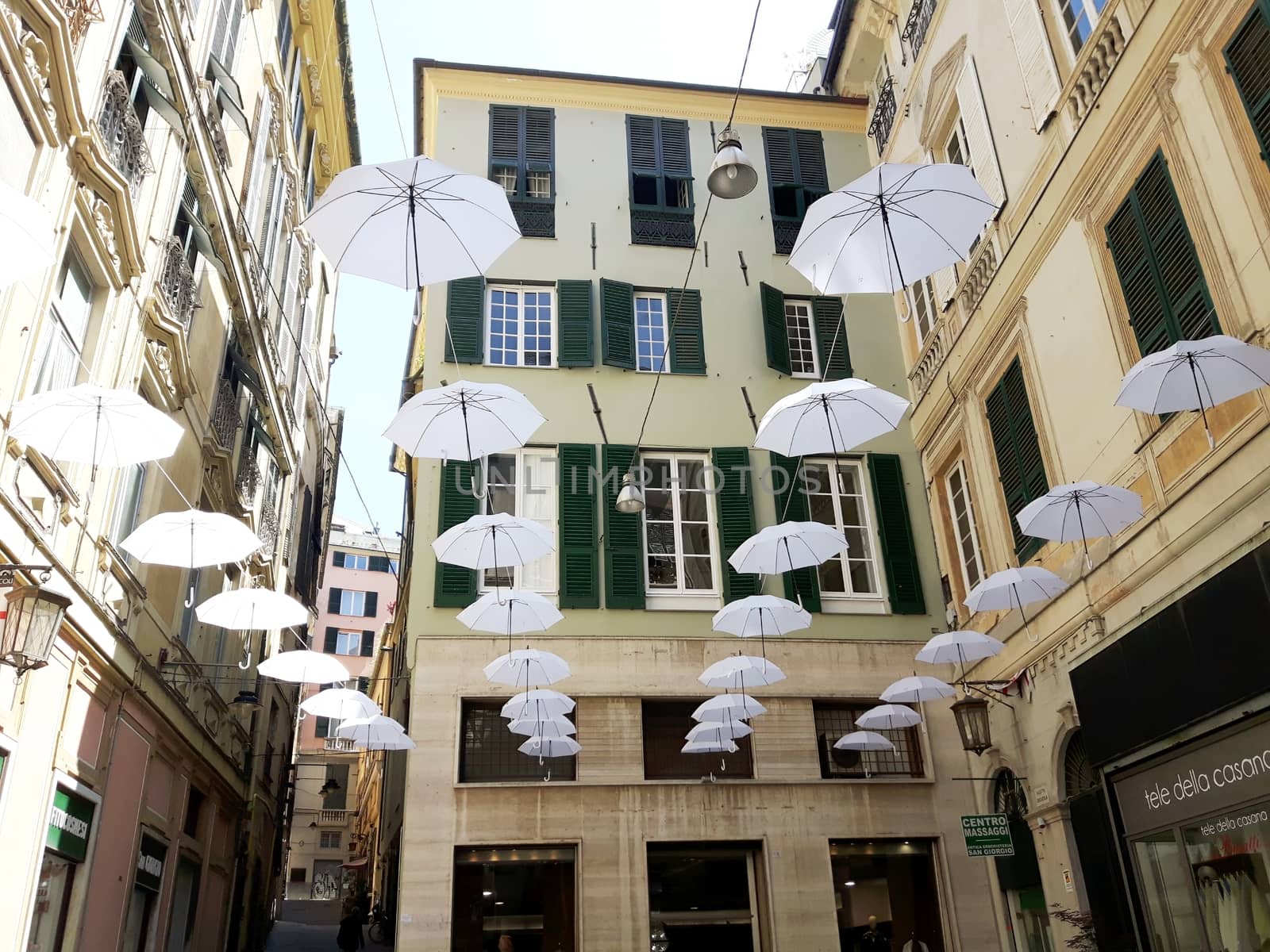 Genova, Italy - 06/01/2020: Bright abstract background of jumble of rainbow colored umbrellas over the city celebrating gay pride