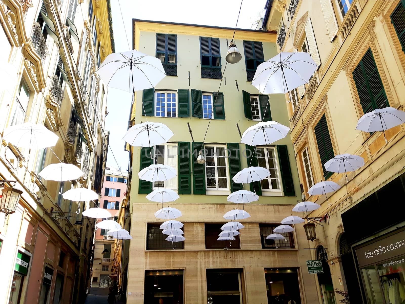 Genova, Italy - 06/01/2020: Bright abstract background of jumble of rainbow colored umbrellas over the city celebrating gay pride