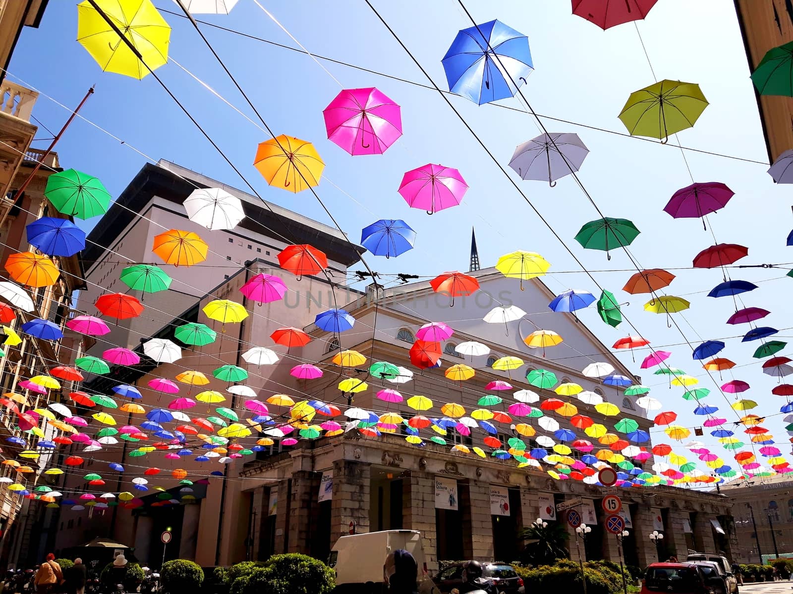 Genova, Italy - 06/01/2020: Bright abstract background of jumble of rainbow colored umbrellas over the city celebrating gay pride