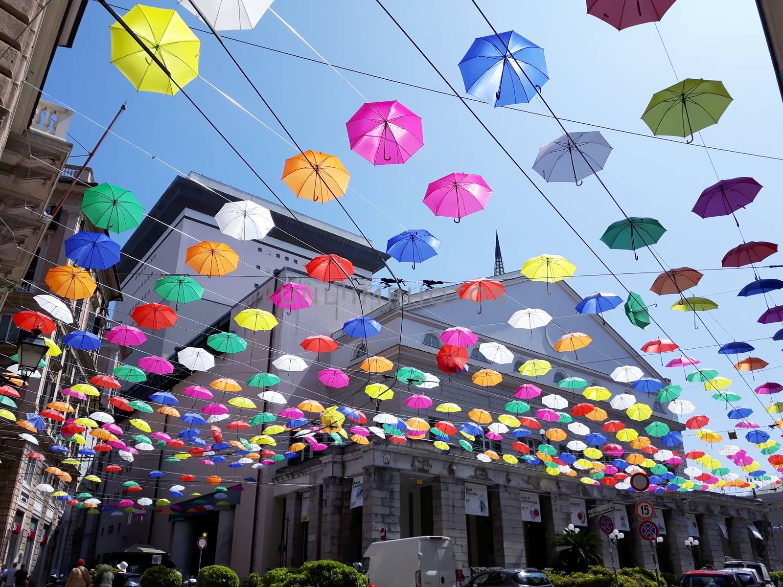 Genova, Italy - 06/01/2020: Bright abstract background of jumble of rainbow colored umbrellas over the city celebrating gay pride