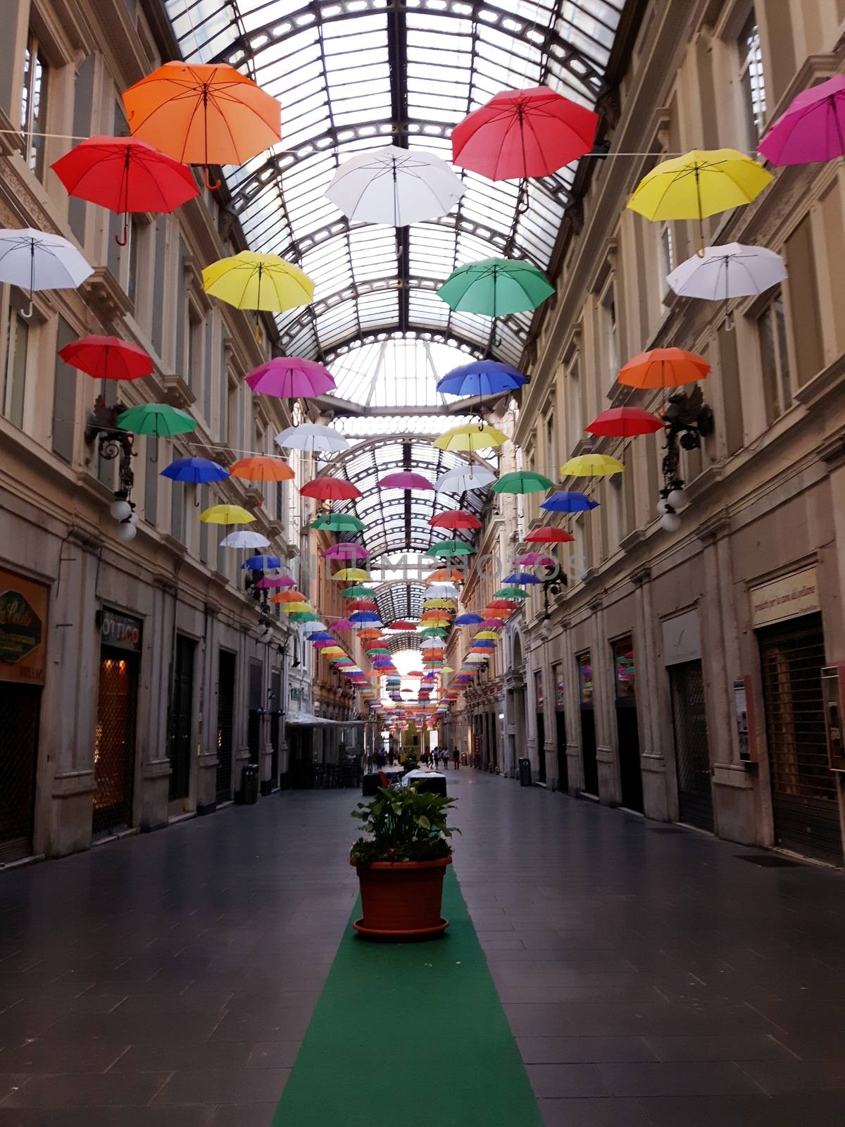 Genova, Italy - 06/01/2020: Bright abstract background of jumble of rainbow colored umbrellas over the city celebrating gay pride