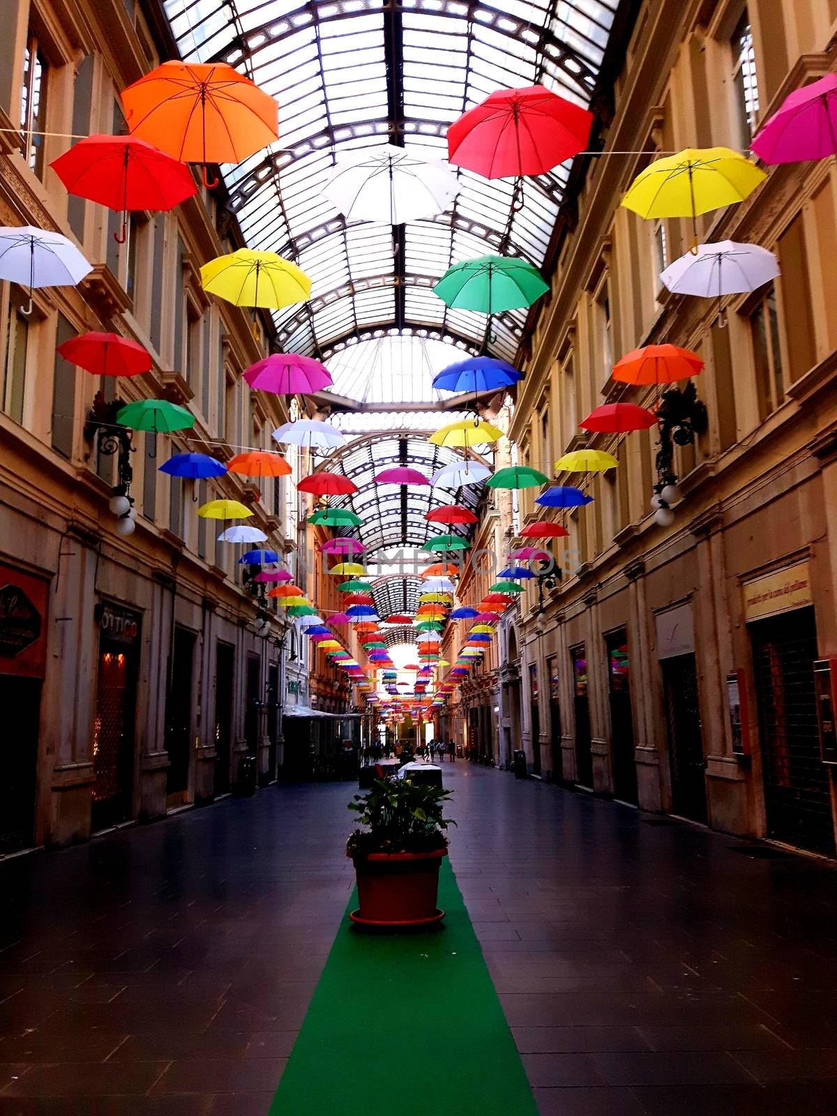 Genova, Italy - 06/01/2020: Bright abstract background of jumble of rainbow colored umbrellas over the city celebrating gay pride