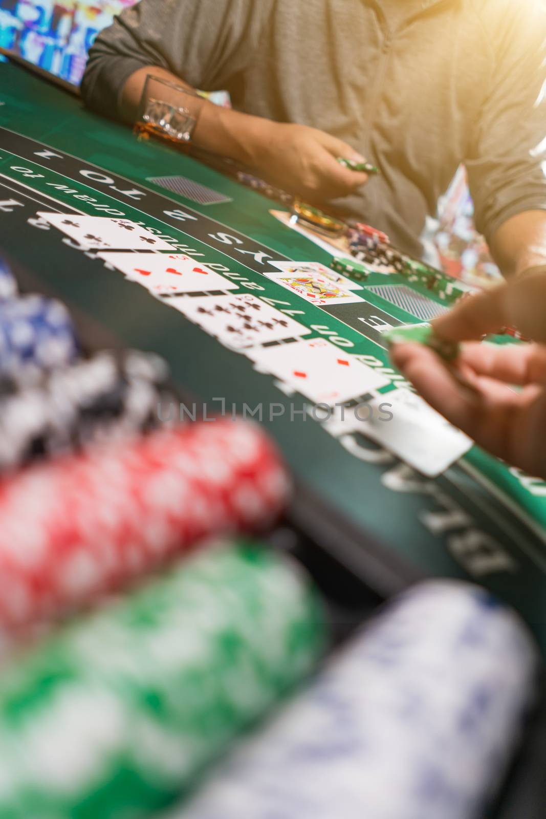 Man playing BlackJack at the casino - Shallow depth of field